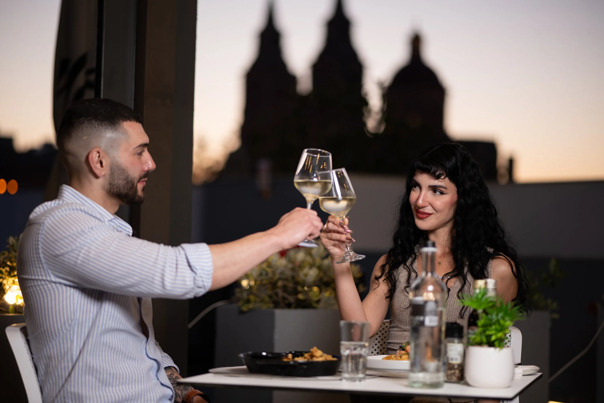 Commercial hospitality photography capturing guests enjoying an outdoor dining experience at a restaurant in Malta.