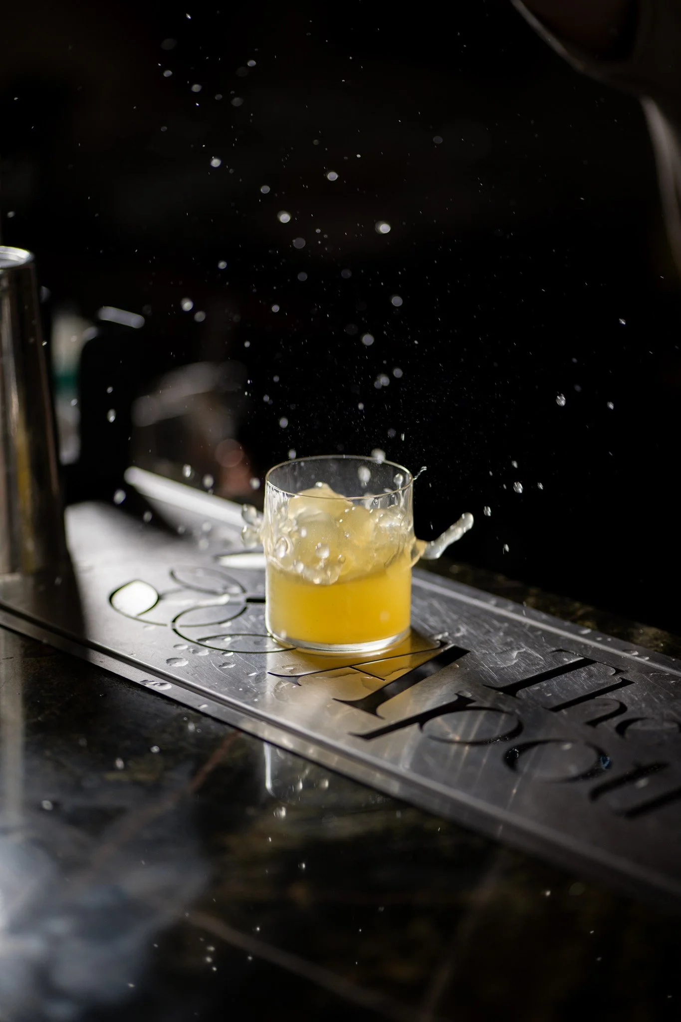 Hospitality photography featuring a handcrafted cocktail with premium garnish and atmospheric lighting.