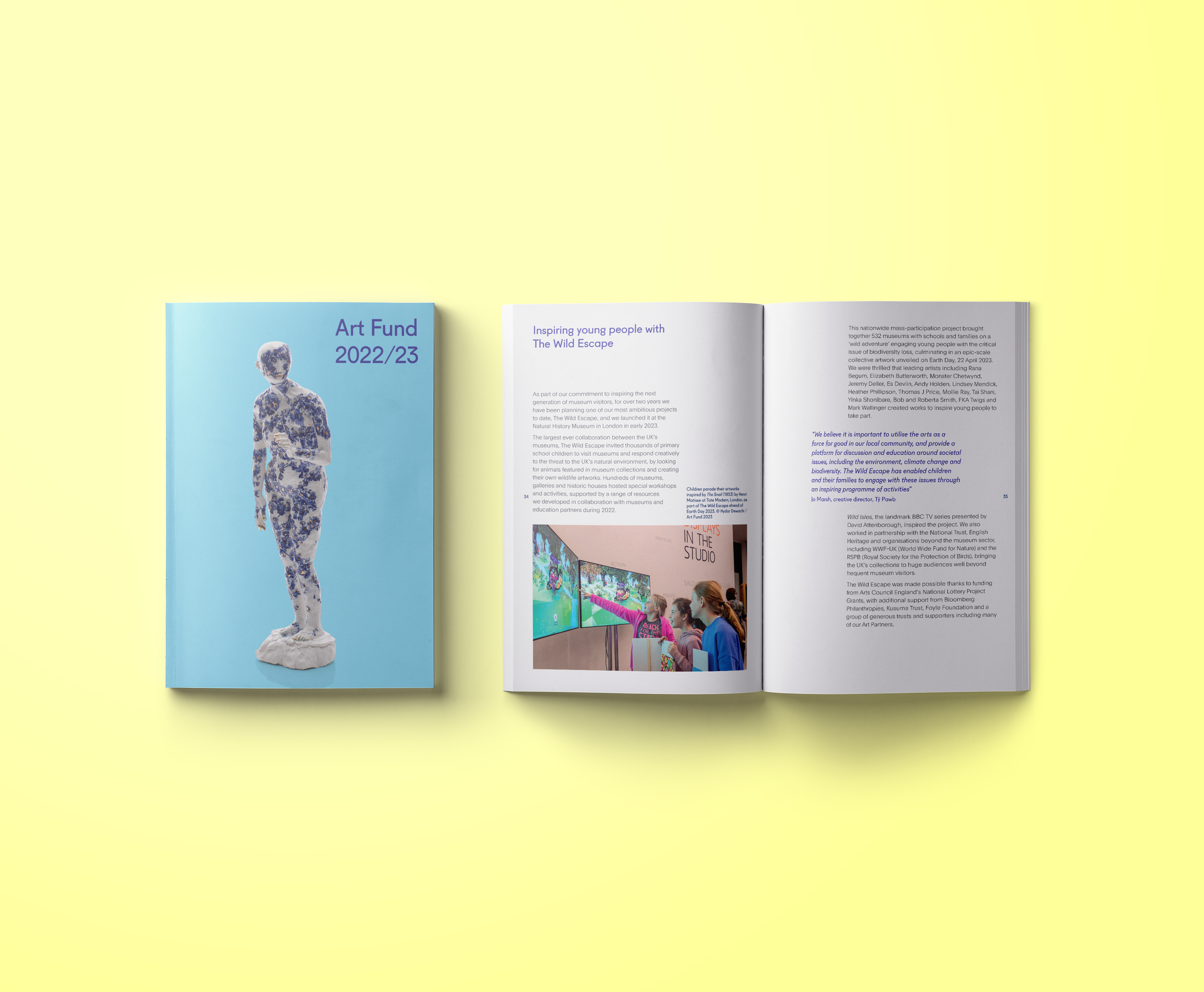 Open magazine with a blue cover titled "Art Fund 2022/23" and a white interior page with text and a photograph of children at an exhibit.