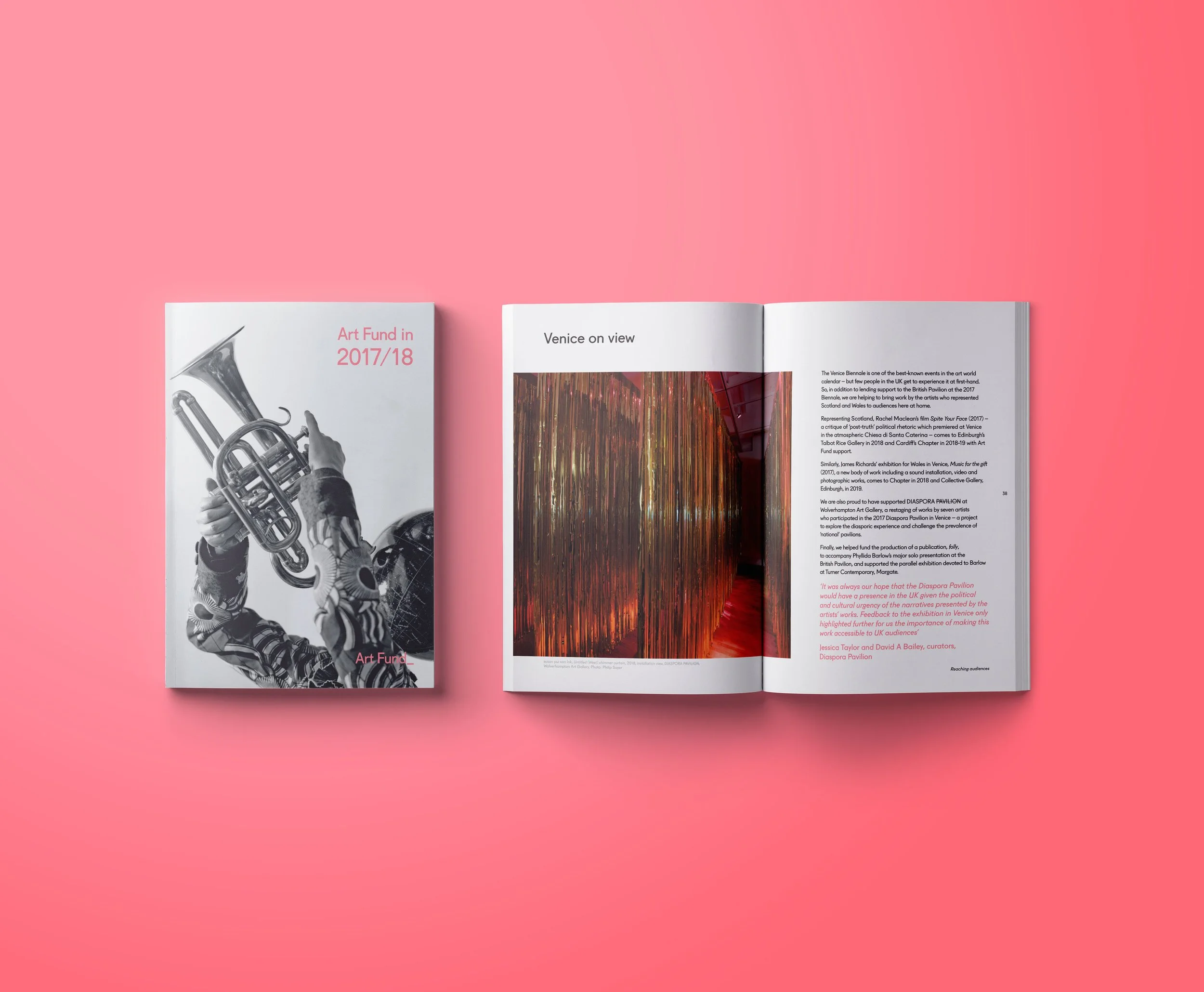 An open magazine lying on a pink background, showing a black and white photo of someone playing a trumpet on the left page and text with a colorful abstract image on the right page.