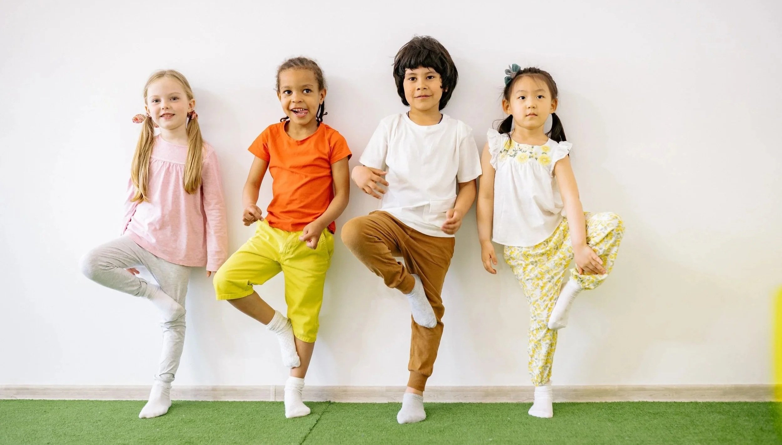 Children participating in an interactive, play-based English language learning activity.