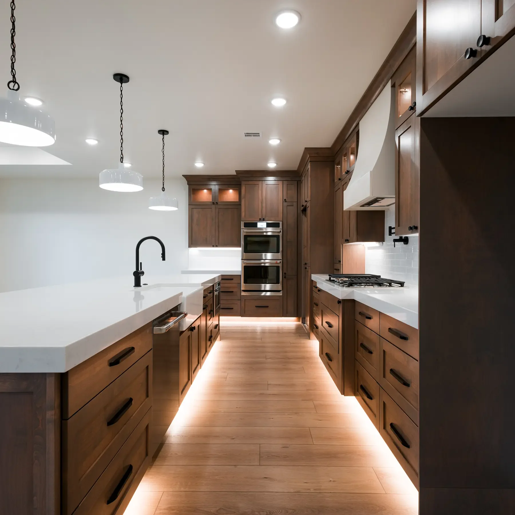Luxurious modern kitchen with wooden cabinets, and toe kicking lighting
