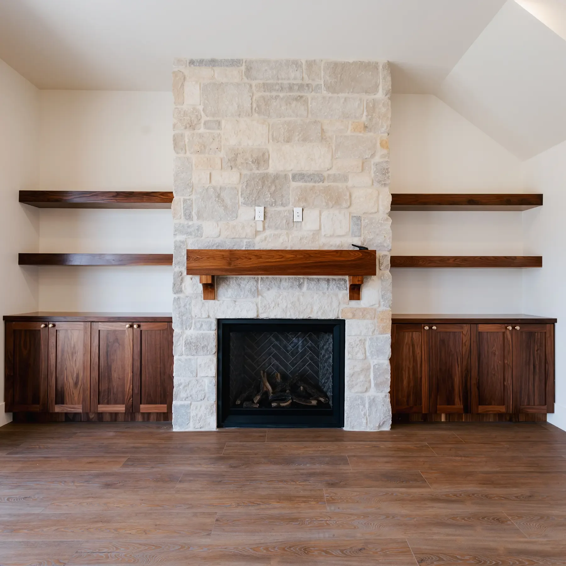 Stone and wood accent wall with fireplace in Southern Utah home