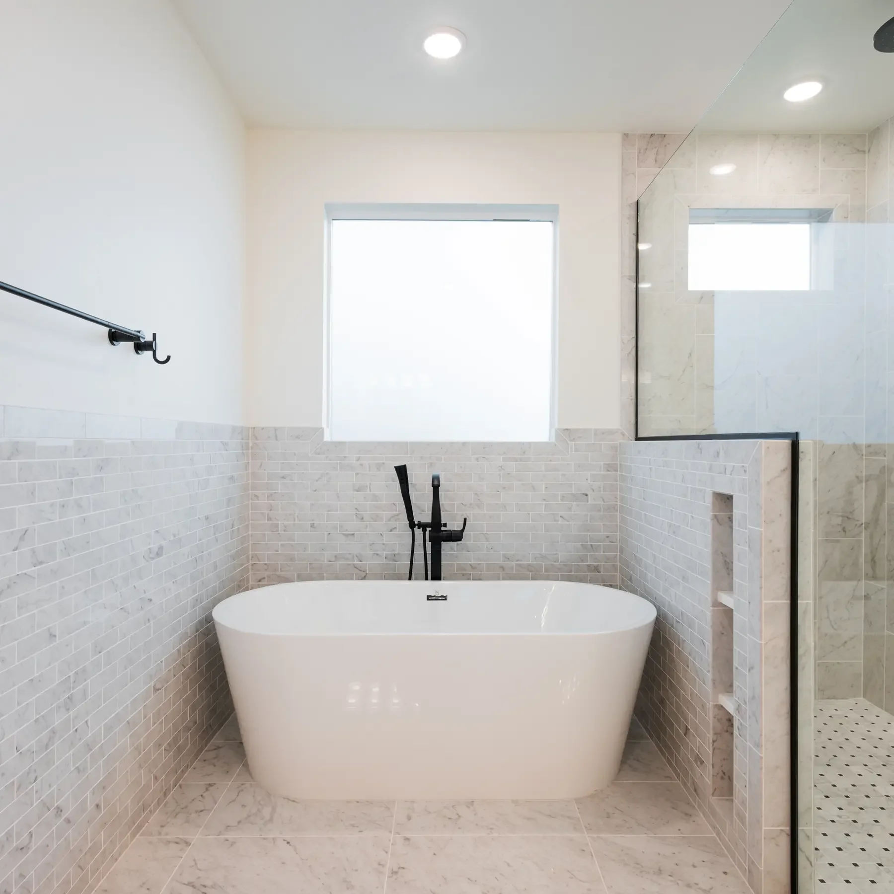 Modern, airy and bright bathroom with standalone tub