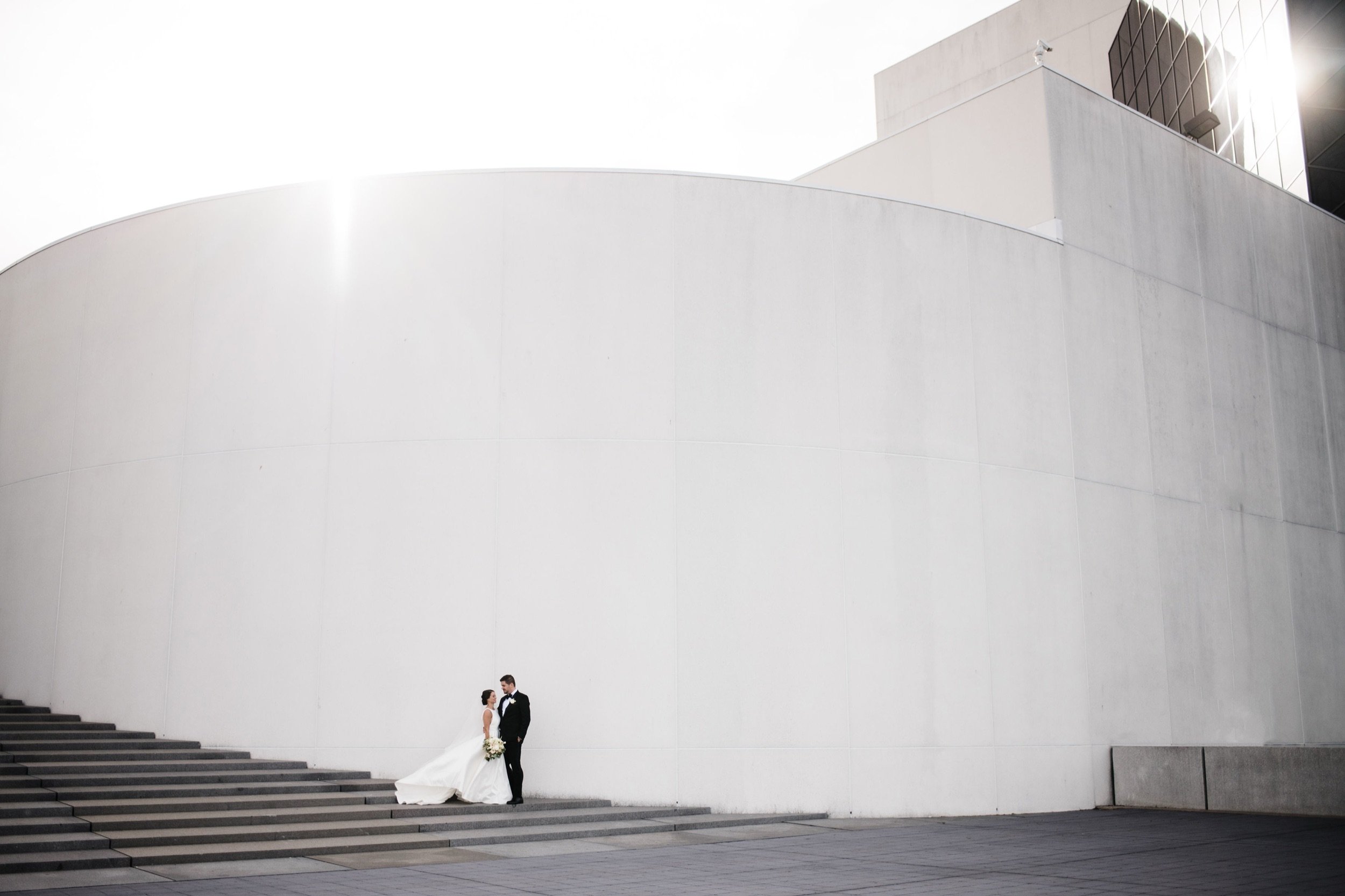 Bride and groom outside JFK library and Presidential center.