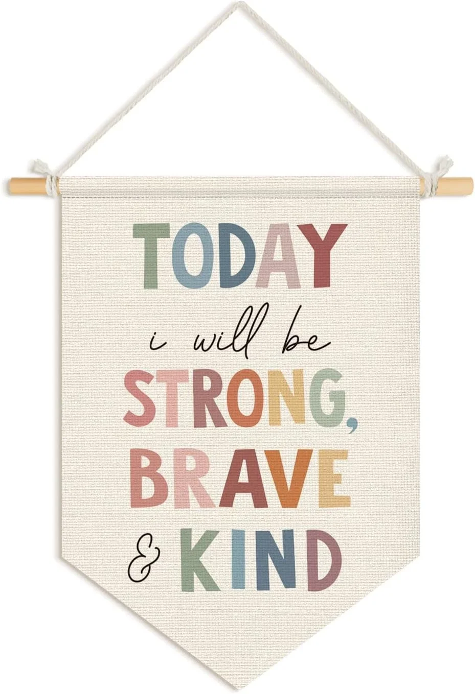 A decorative fabric wall hanging with a motivational message reading, "Today I will be strong, brave, and kind," in multicolored letters, suspended from a wooden rod with a white cord.