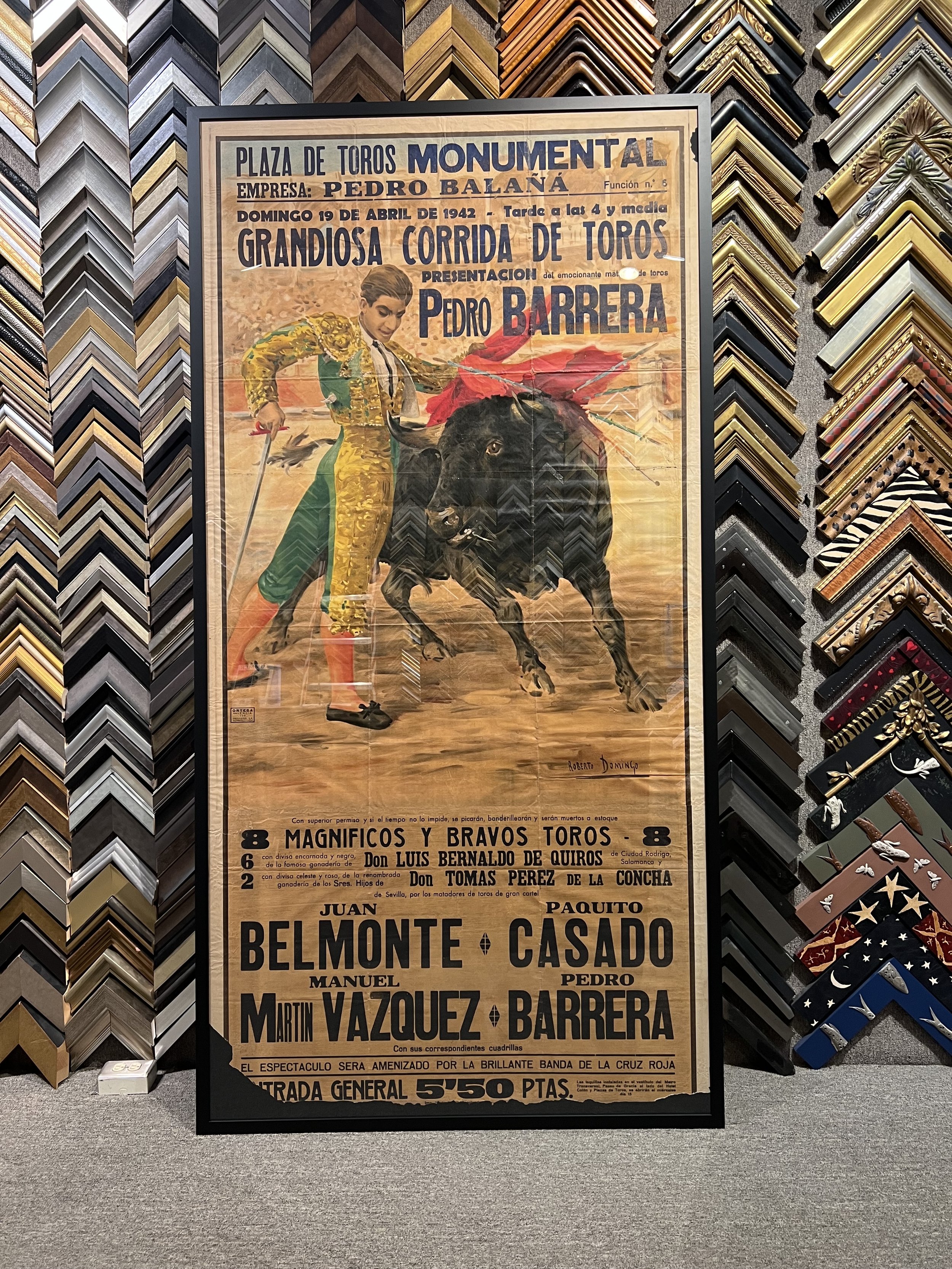 Vintage poster advertising a bullfight event at Plaza de Toros Monteval, featuring performers Pedro Barrera, Luis Bernaldo de Quirós, Toma Pérez, Juan Belmonte, and others. The poster is surrounded by decorative picture frames.