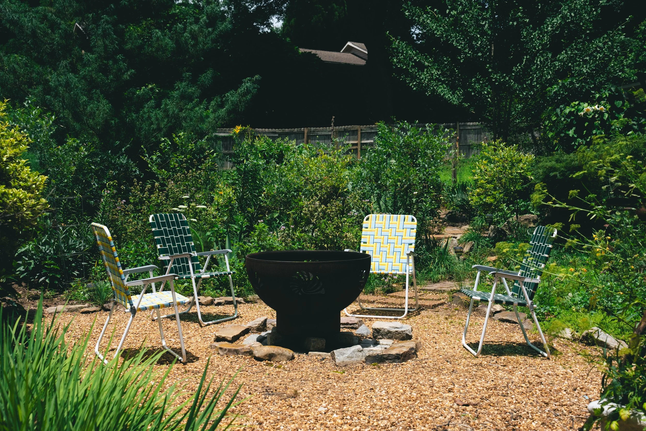 Firepit! With a wall of Blueberry bushes behind it.