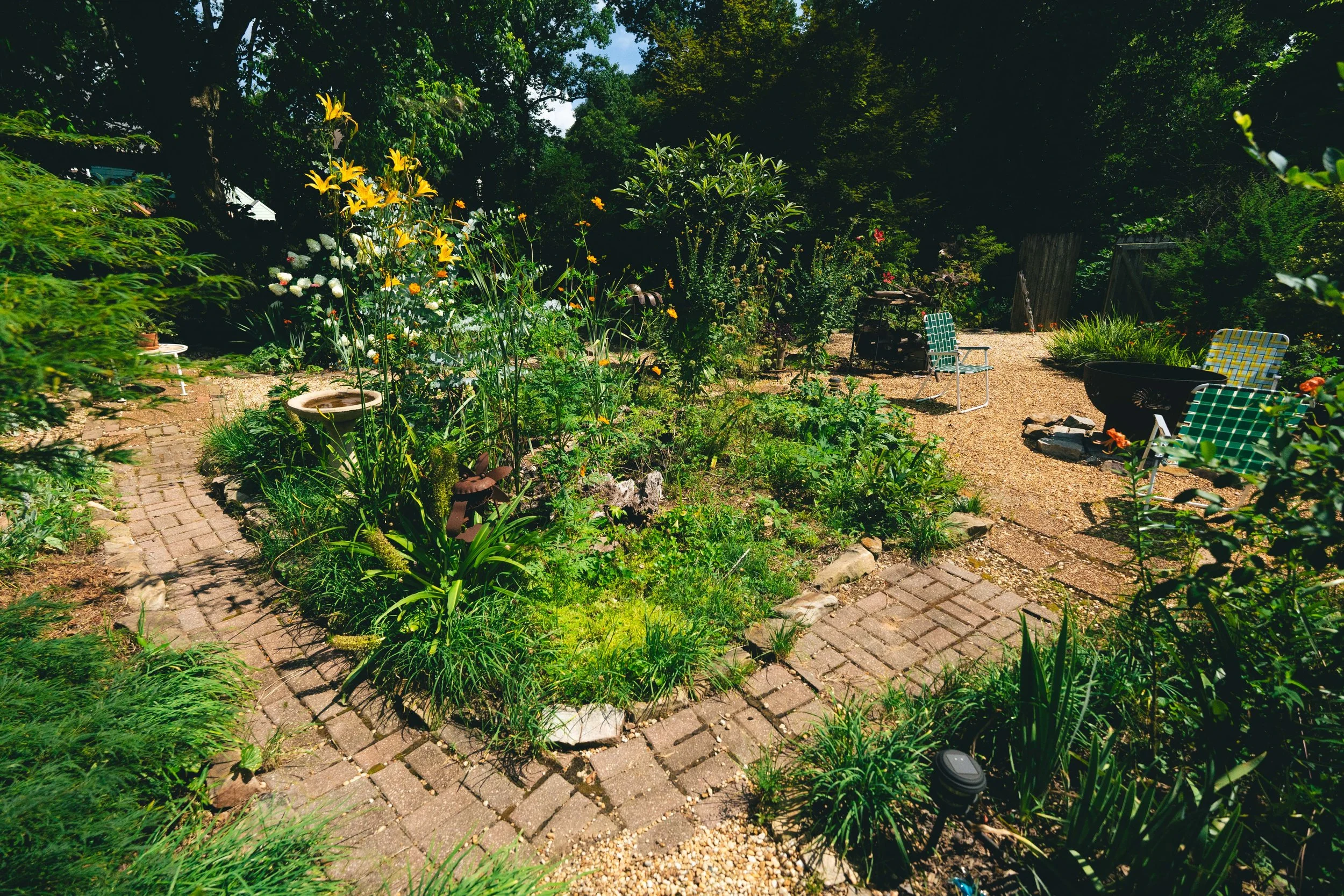 Brick laid paths throughout! Bog, Peonies, Pineapple Lilles, Eucalyptus, Iris and more!