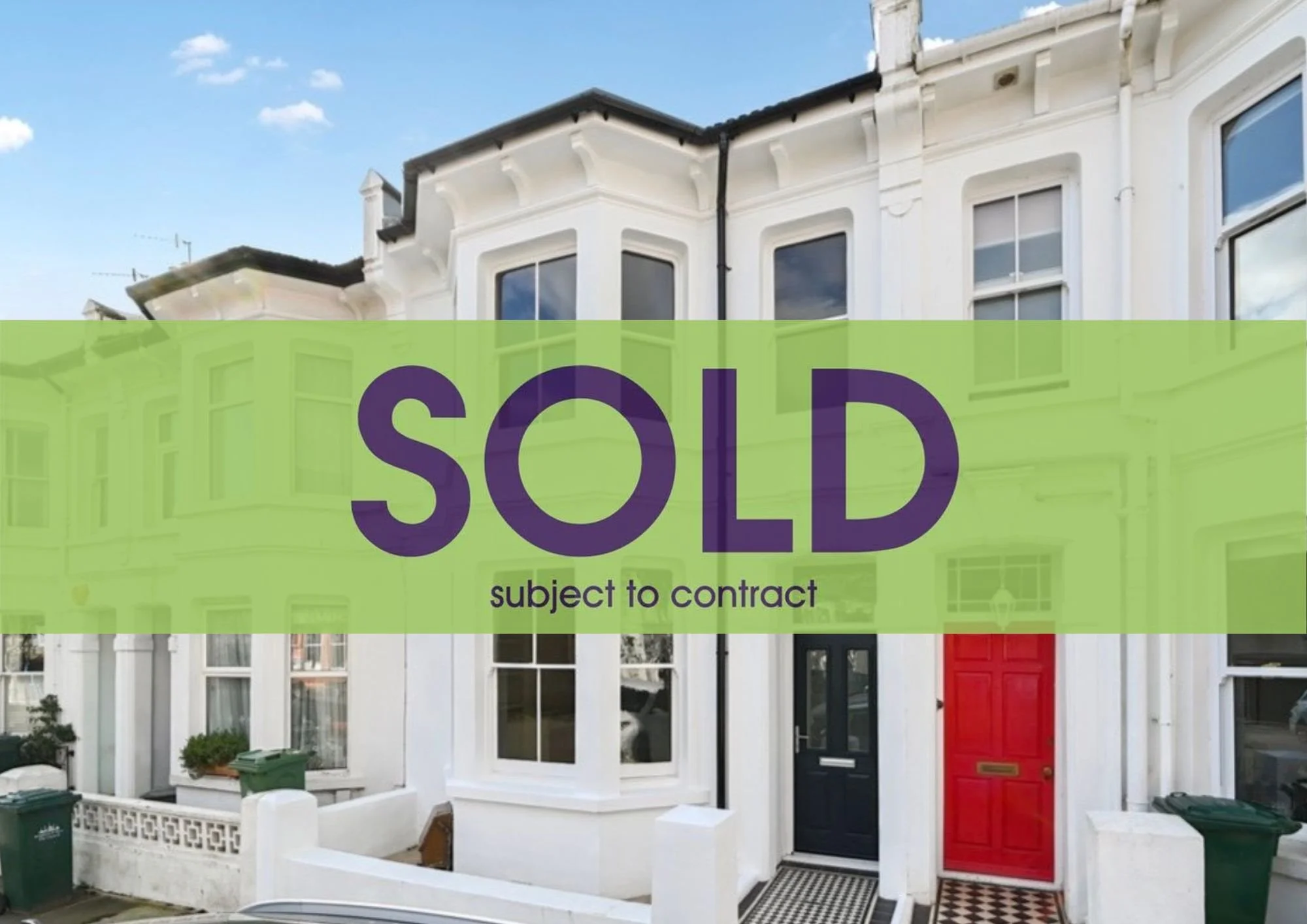 Front view of a white Victorian-style house with large windows and a red front door, with a "SOLD subject to contract" banner overlaid.