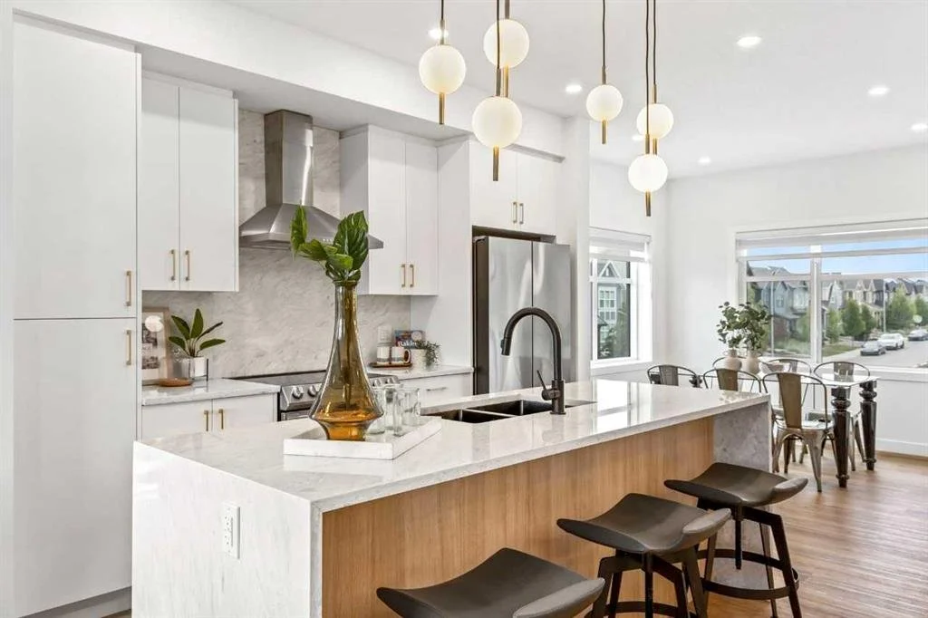 Styled kitchen with curated décor, fresh greenery, and natural accents showcasing home staging techniques for sellers in Victoria BC.