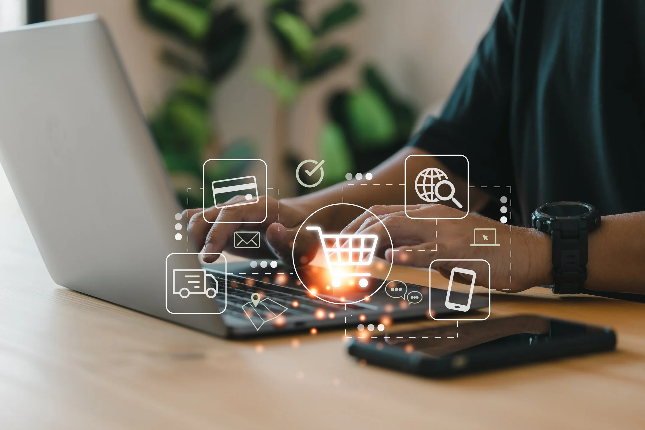 Person typing on a laptop with digital shopping cart and e-commerce icons overlaid.