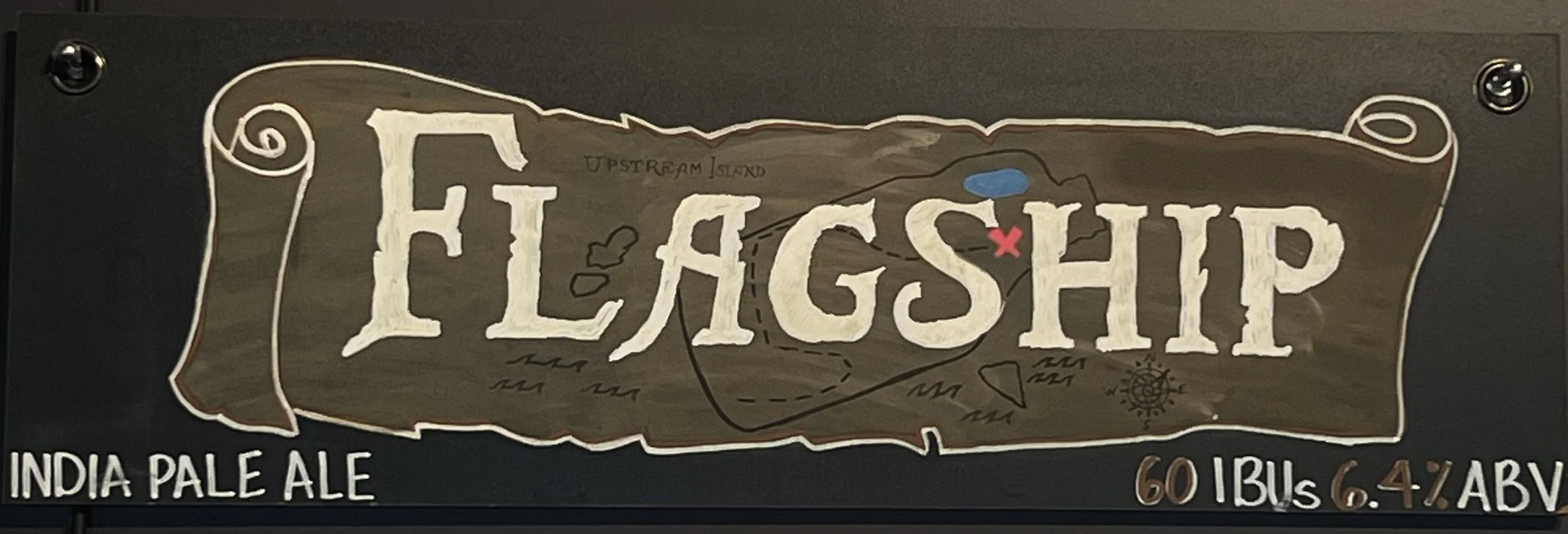 Chalk design of a pirate map that says Flagship. Map in brown and letters in white. says India Pale Ale at the bottom.