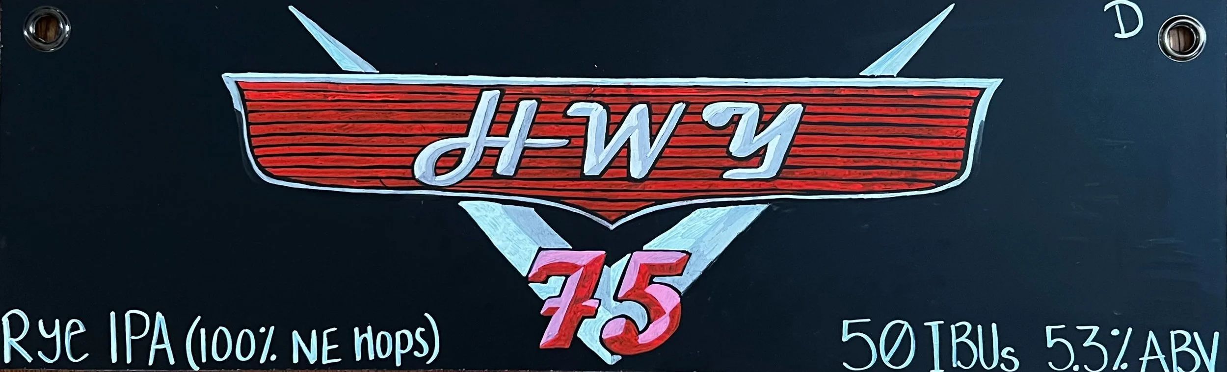 Chalk design inspired by the Cars movie. Says HWY 75 on a car emblem in red and silver. Says rye IPA at the bottom.