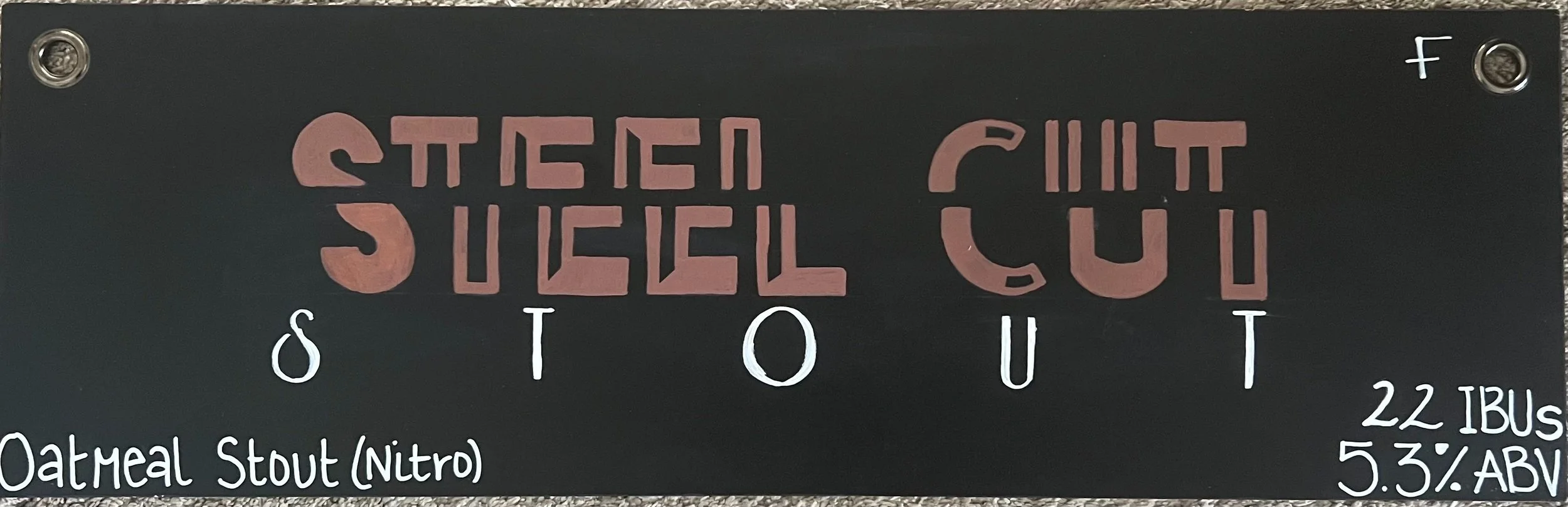 Chalk design that says Steel Cut with the letters cut down the middle, horizontal and a little off center from each other. The word Stout below it. On the bottom right, it says Oatmeal Stout (Nitro)