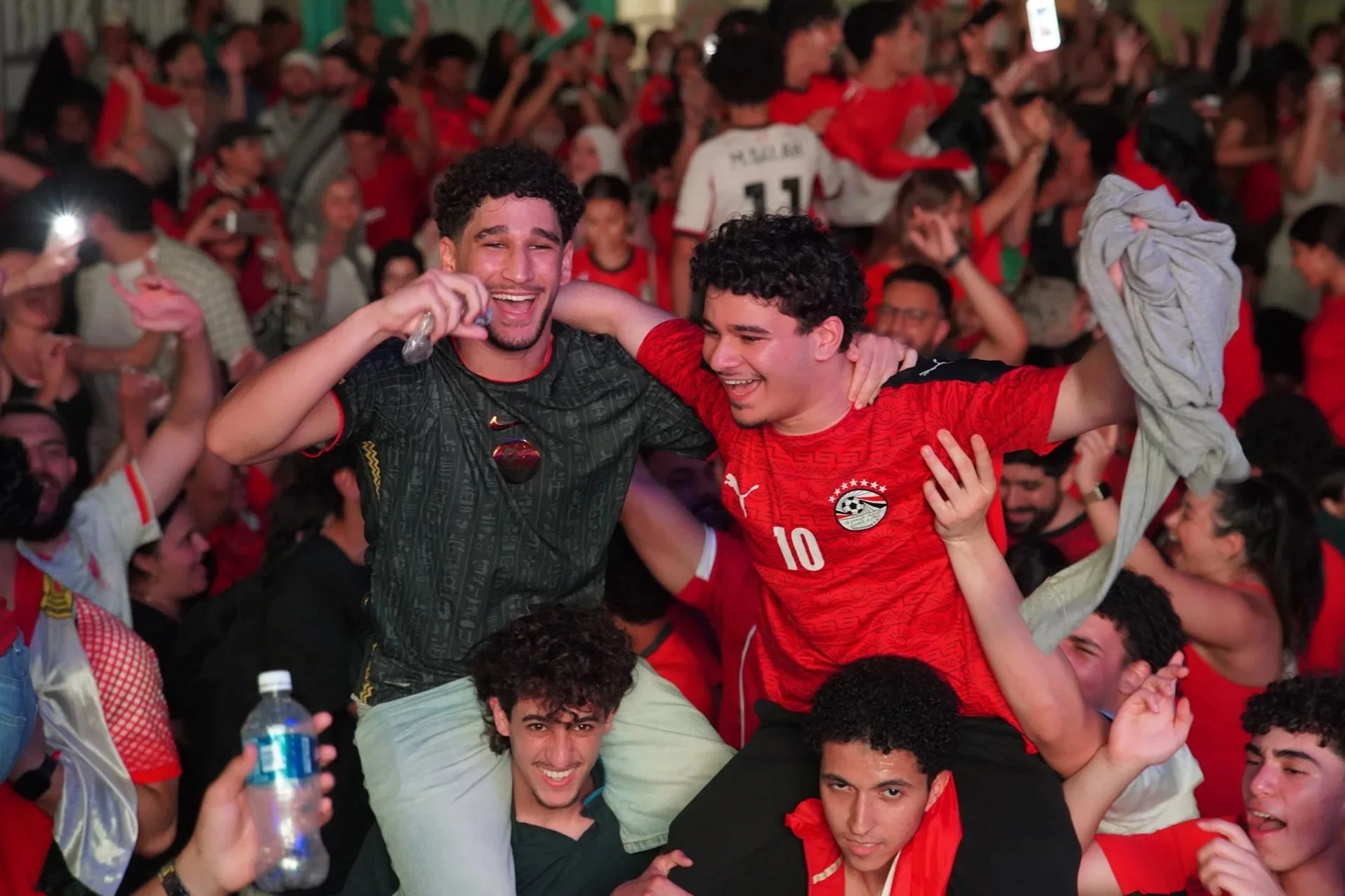 Egyptian and Arab fans celebrating the World Cup at Legacy Hall in Plano, Texas during an Egypt DFW community gathering in Dallas–Fort Worth.