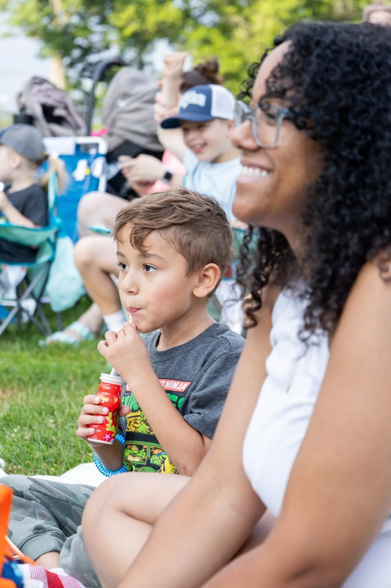 Downtown Milford summer events: Outdoor movie night featuring local residents on blankets. Every wednesday in july summer outdoor movies in downtown milford organized by the Downtown Milford Business Association.