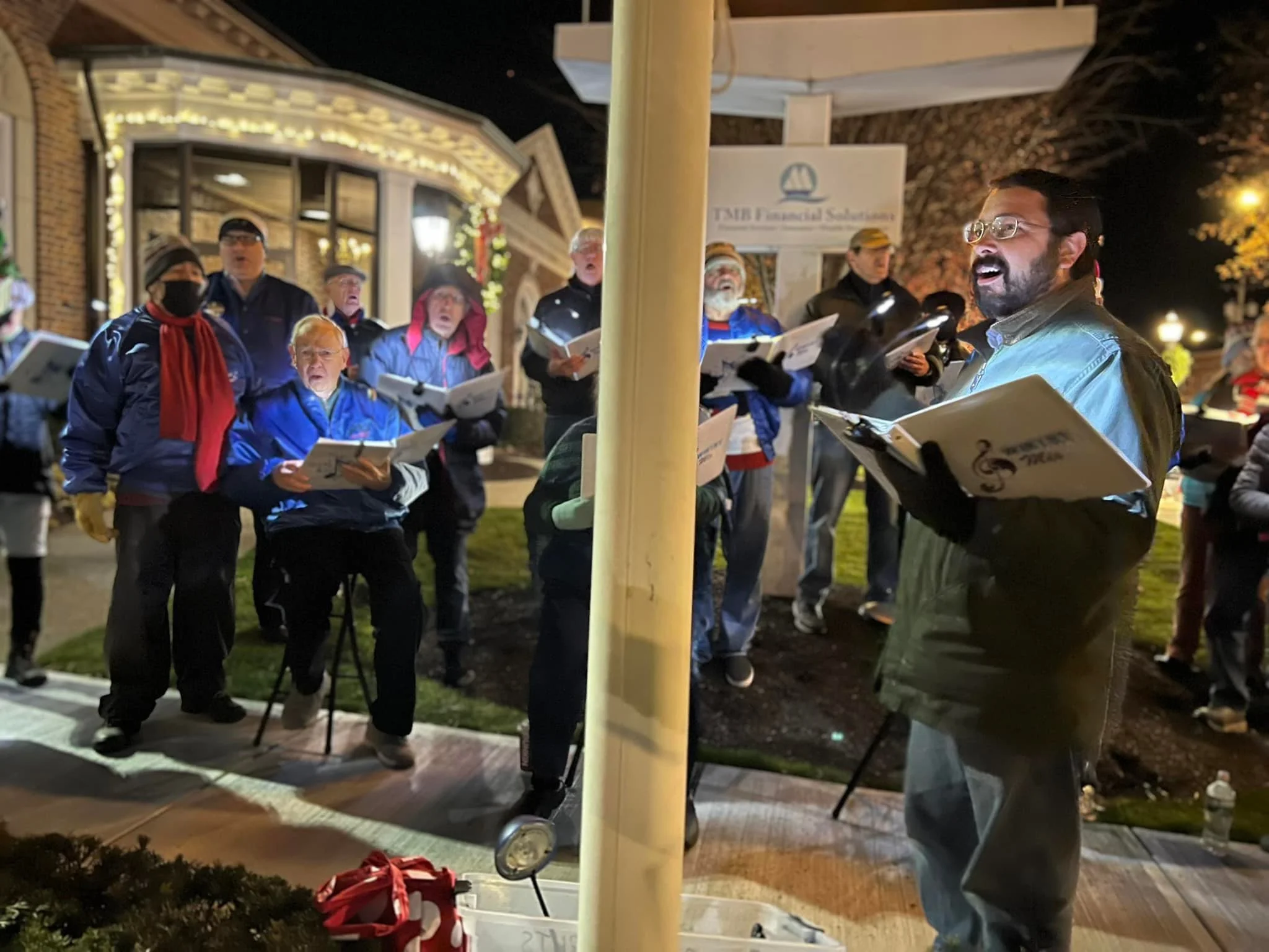 Christmas carolers singing holiday favorites during the Lamplight Stroll in Downtown Milford. 