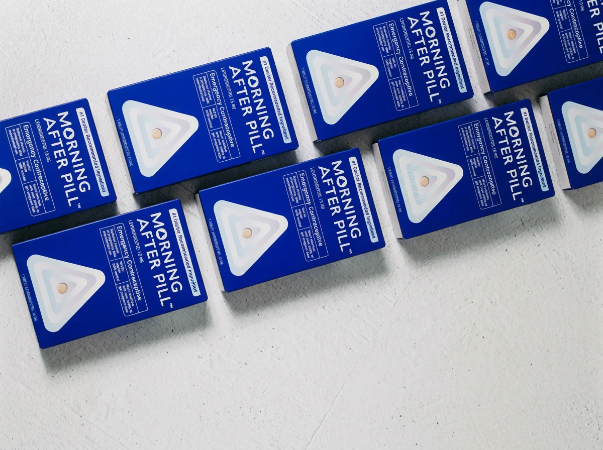 Cadence OTC product boxes stacked on a white surface