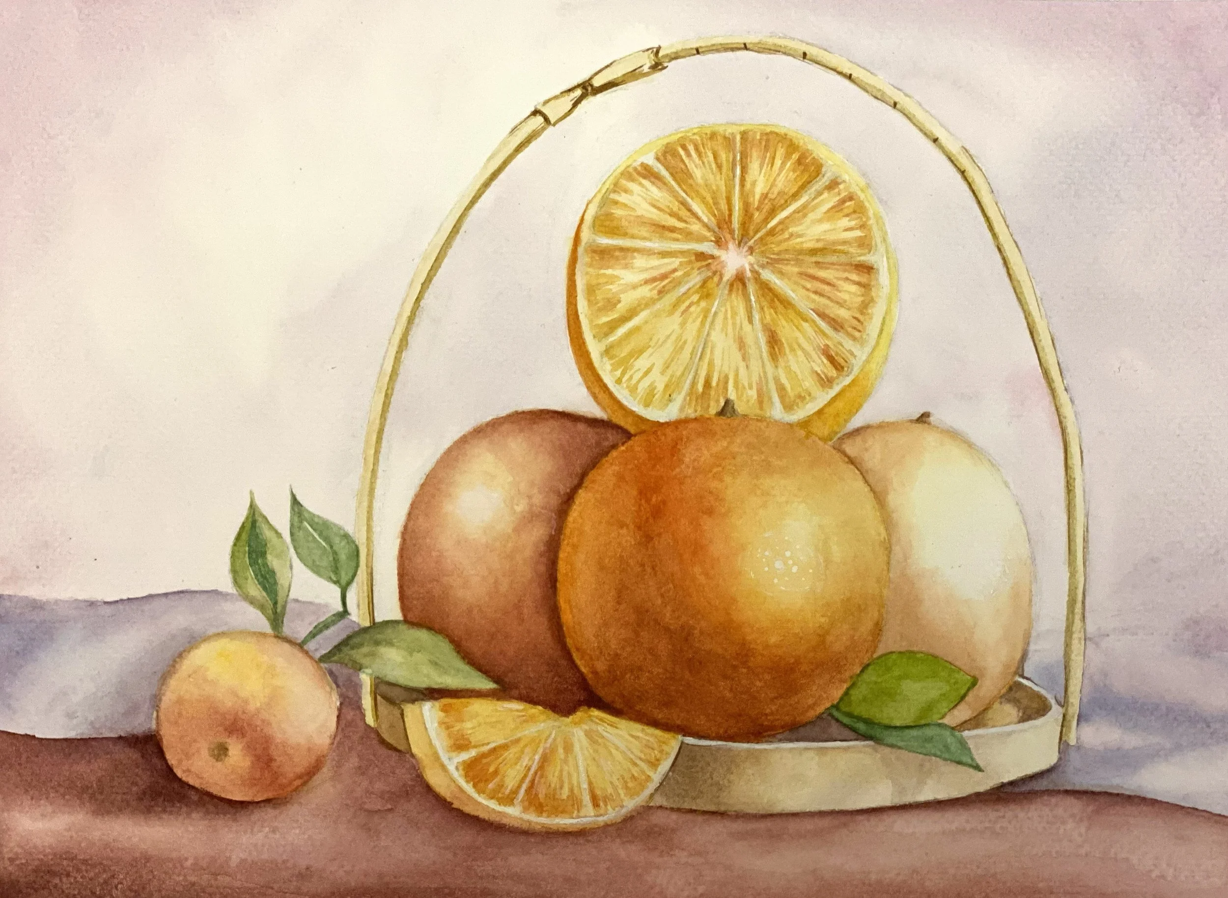 Watercolor painting of a basket filled with oranges, some whole and sliced, with green leaves.
