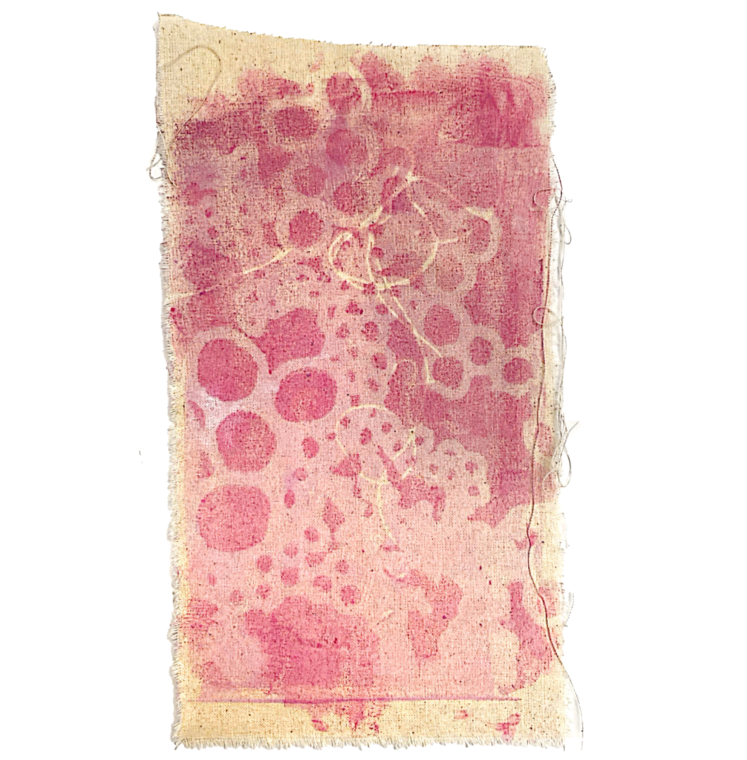 A worn piece of paper with pink floral and ornamental patterns on a beige background.