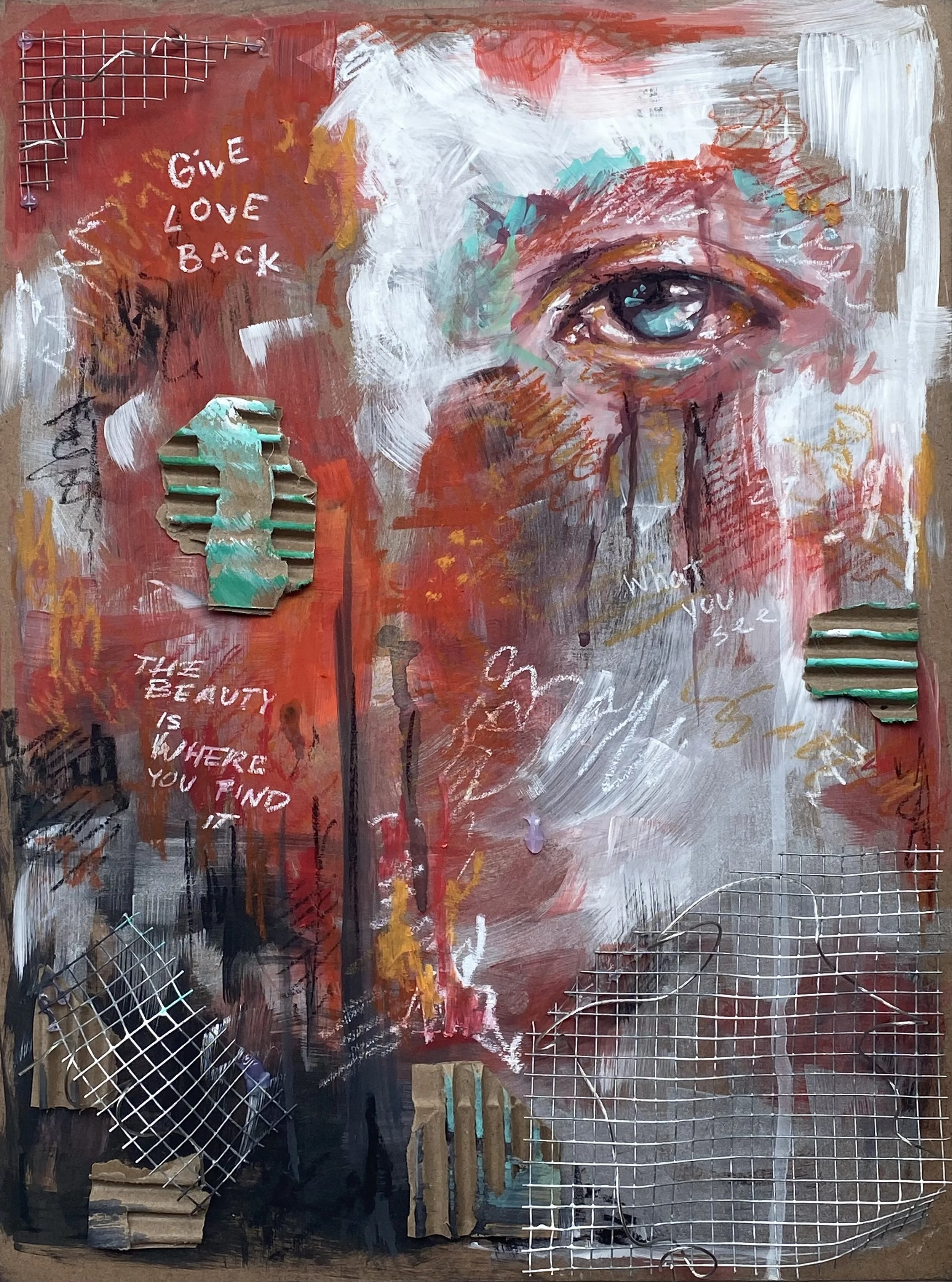 Mixed media artwork featuring a realistic eye painted on a textured background with red, white, and black brushstrokes. The piece includes phrases like 'GIVE LOVE BACK' and 'THE BEAUTY IS WHERE YOU FIND IT' written in white and red, along with cut-out pieces of textured paper and metal wire grid shapes attached to the surface.