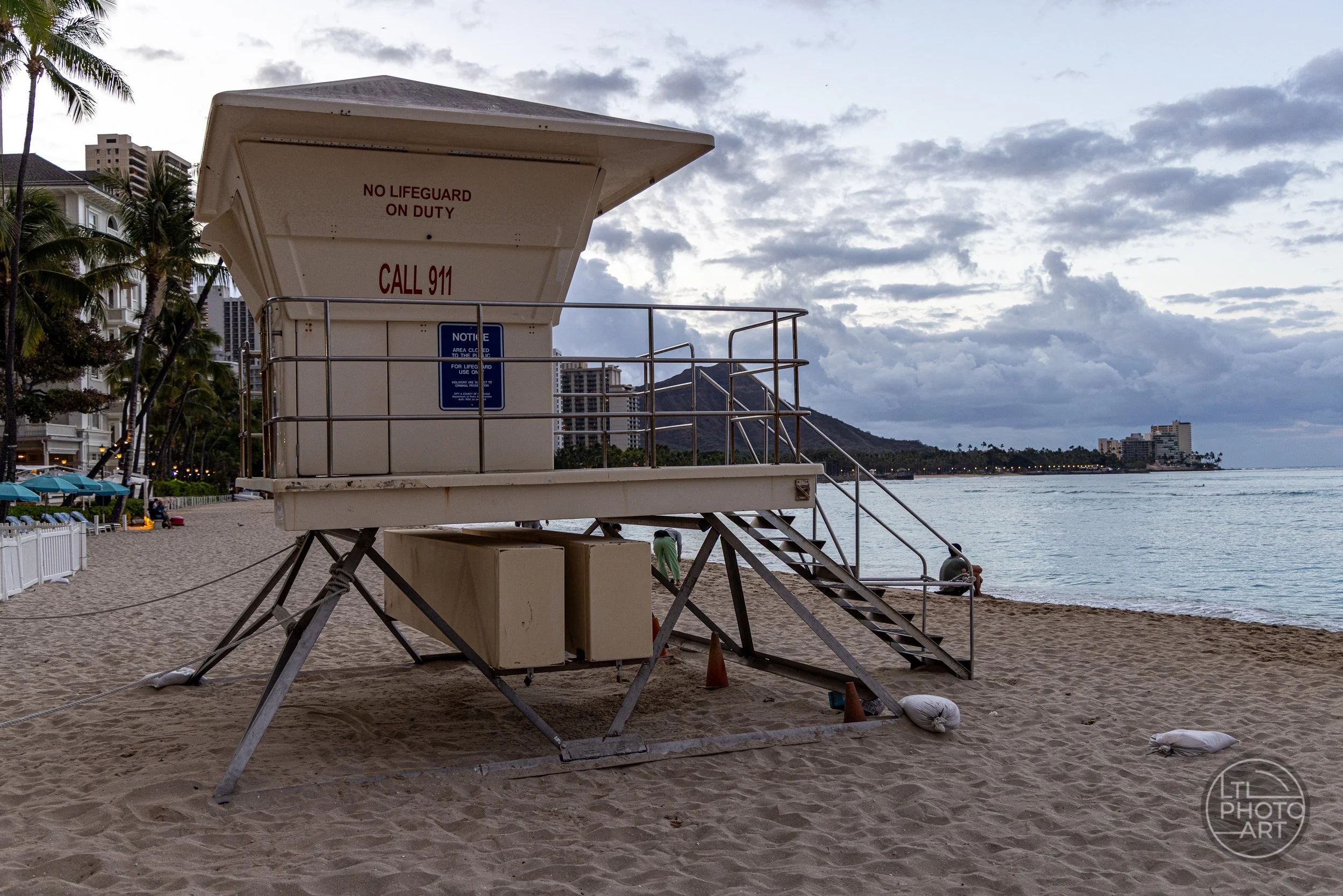 Lifeguard tower on Waikiki Beach, Oahu, Hawaii, with Diamond Head and the Pacific Ocean in the background.