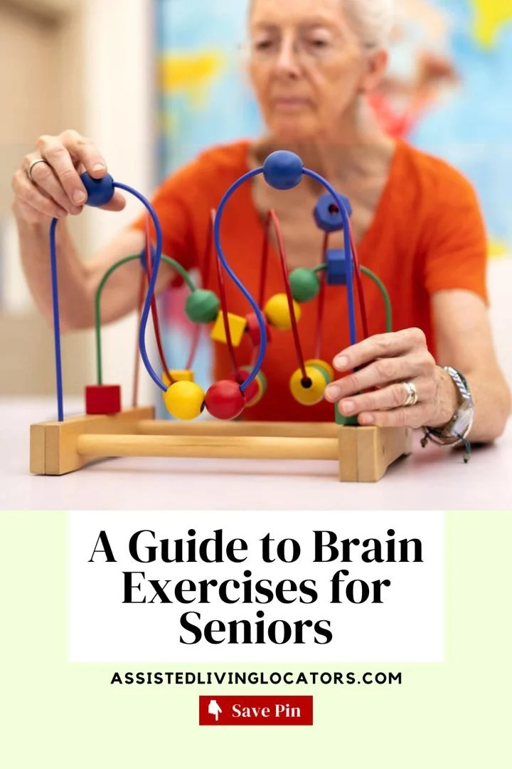 Older woman with gray hair and orange shirt using a bead maze toy with colorful wires and beads.