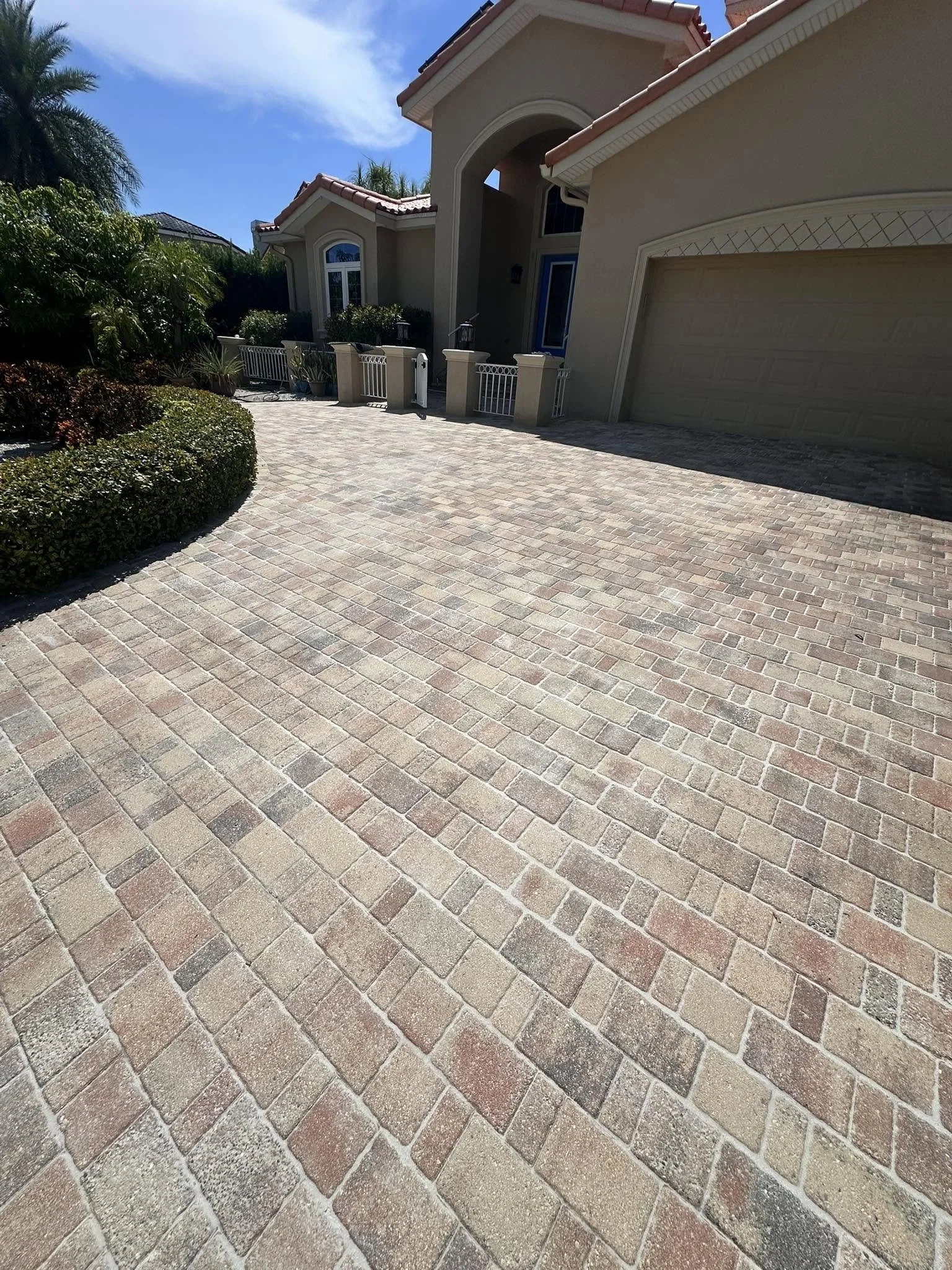 Paver driveway restoration with pressure washing and sealing in Florida
