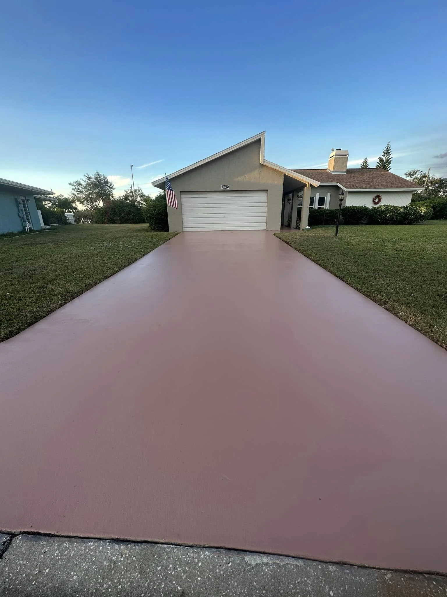 Driveway restoration including crack repair, leveling, and painting — restoring the look and safety of your driveway.
