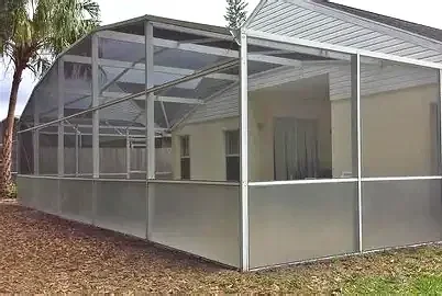 Florida Glass privacy screen installed on lower panels of a pool enclosure for added privacy and debris protection.