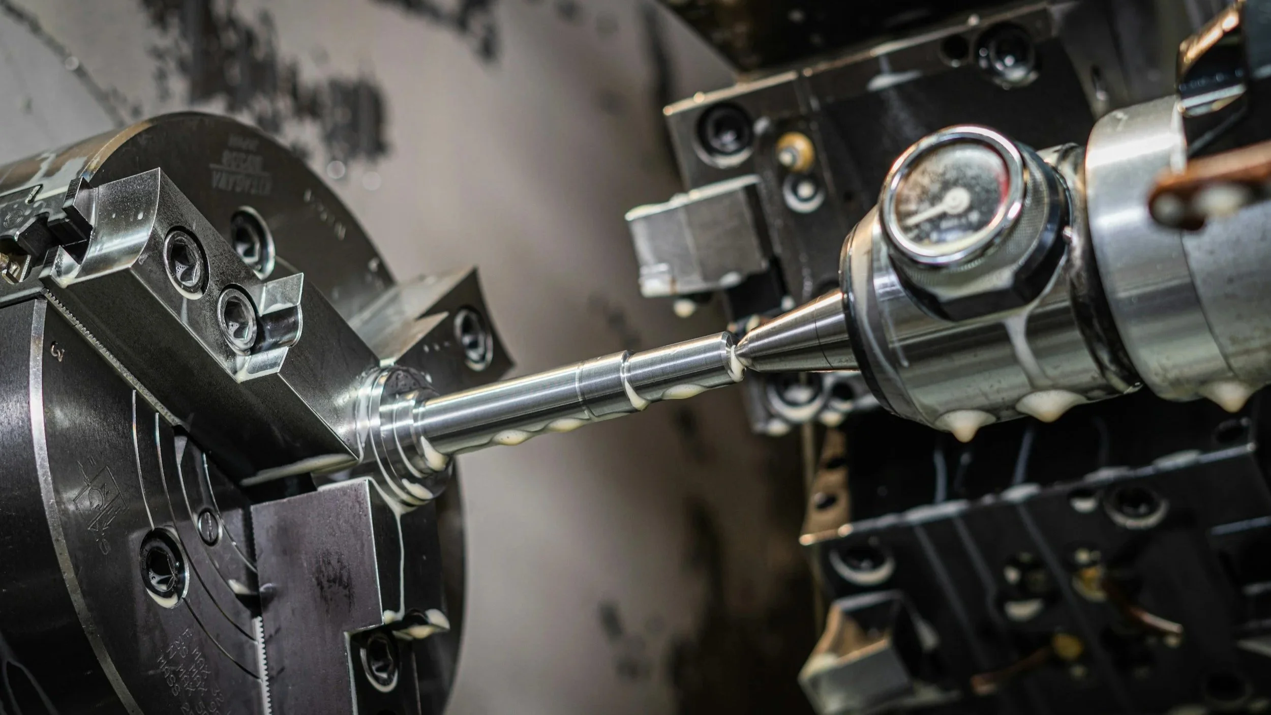 Close-up showing metal parts being machined.