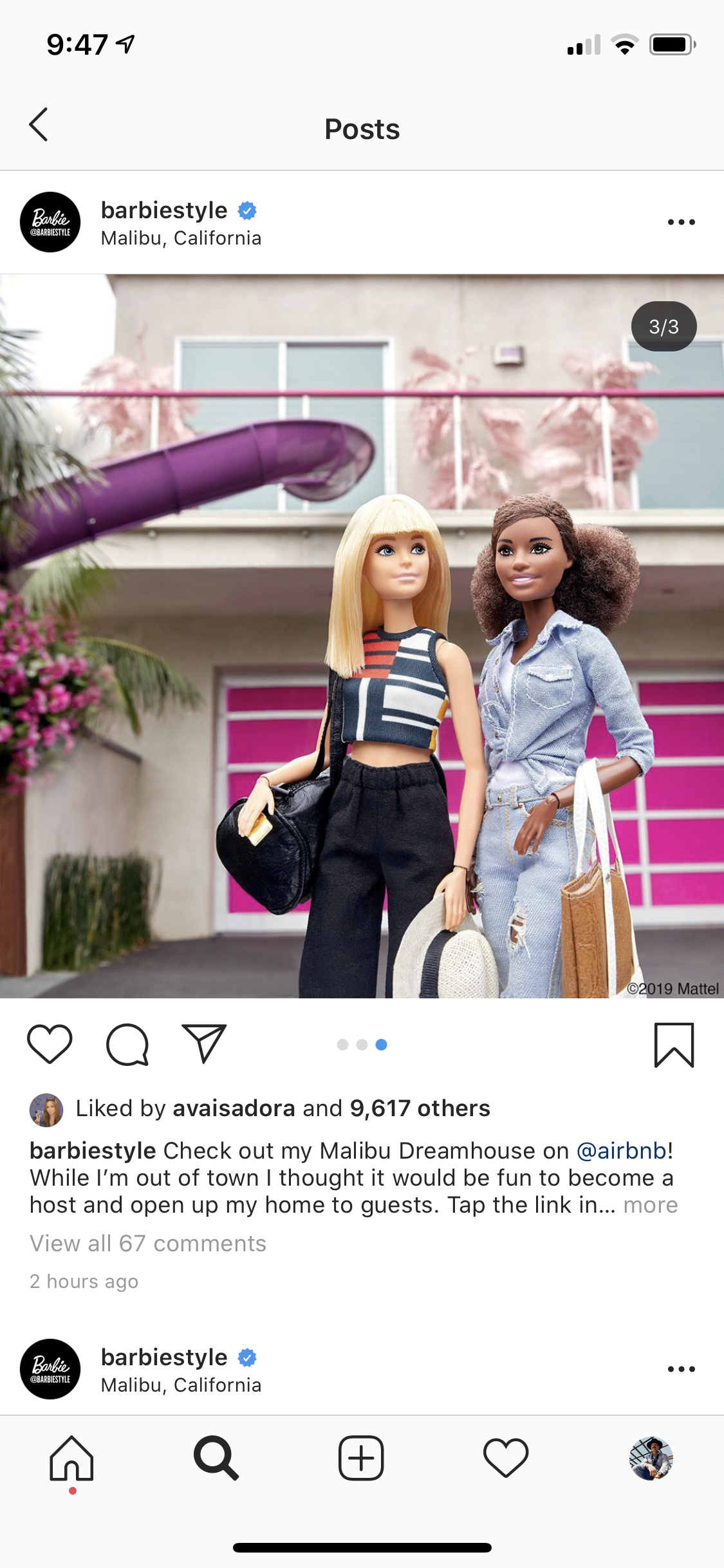 Two Barbie dolls standing in front of a Malibu house with a pink garage door, pink plants on the balcony, and pink slides leading into the backyard, dressed in fashionable casual clothing, holding various accessories.