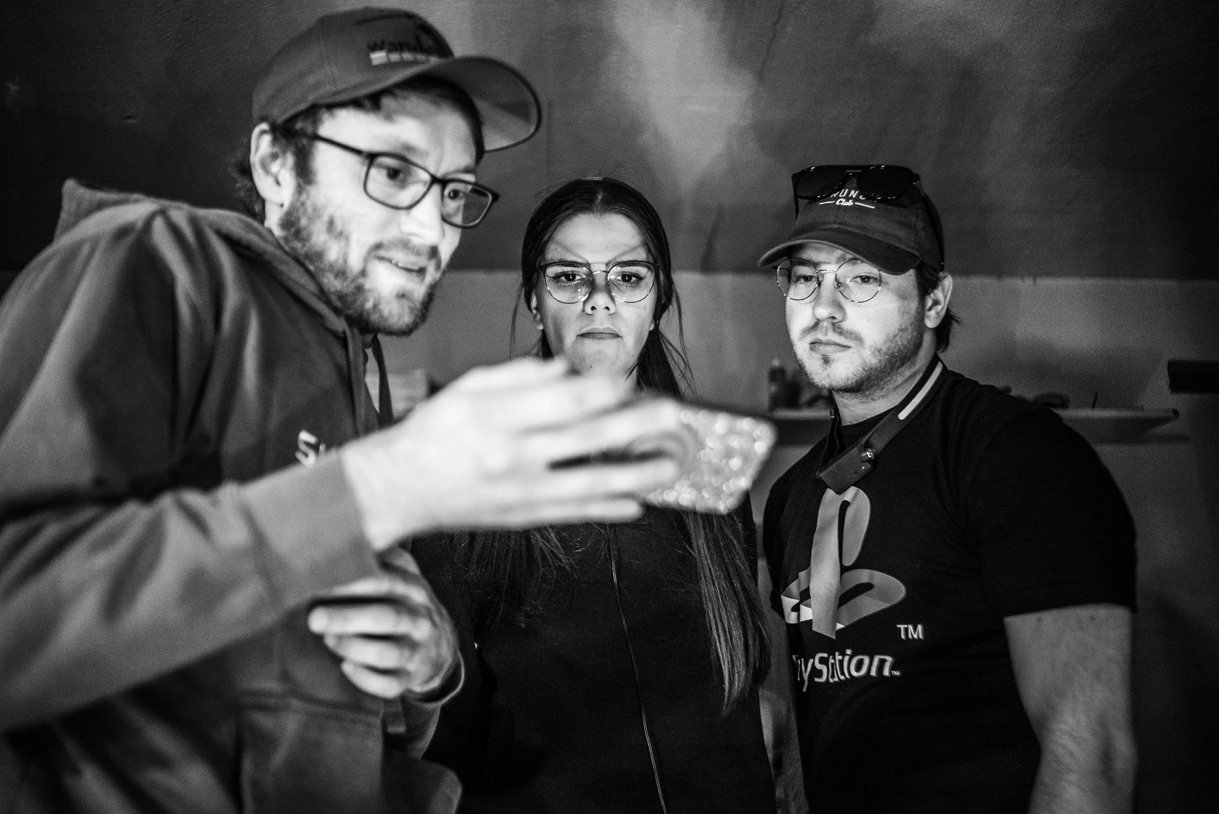 Walking Distance Media Owner, Conor O'Keefe, reviews a shot with Cinematographer, Hali Morlin, and Gaffer, Bobby Wirun on the set of "Pit Stop"