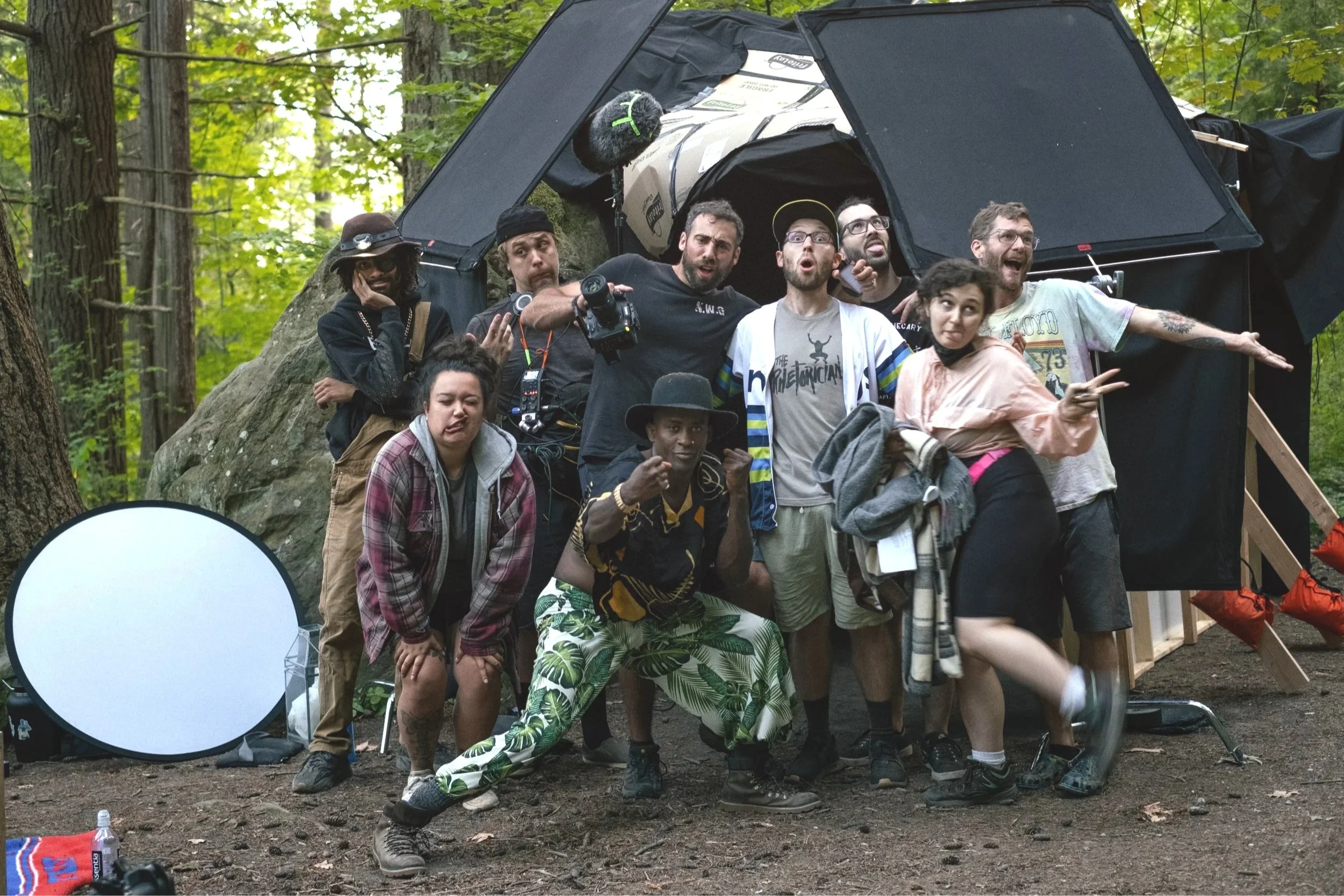 The crew of "DZT: The Descendant of Zack Taylor" huddle together in front of their cave set for a silly group picture. Property of Walking Distance Media.