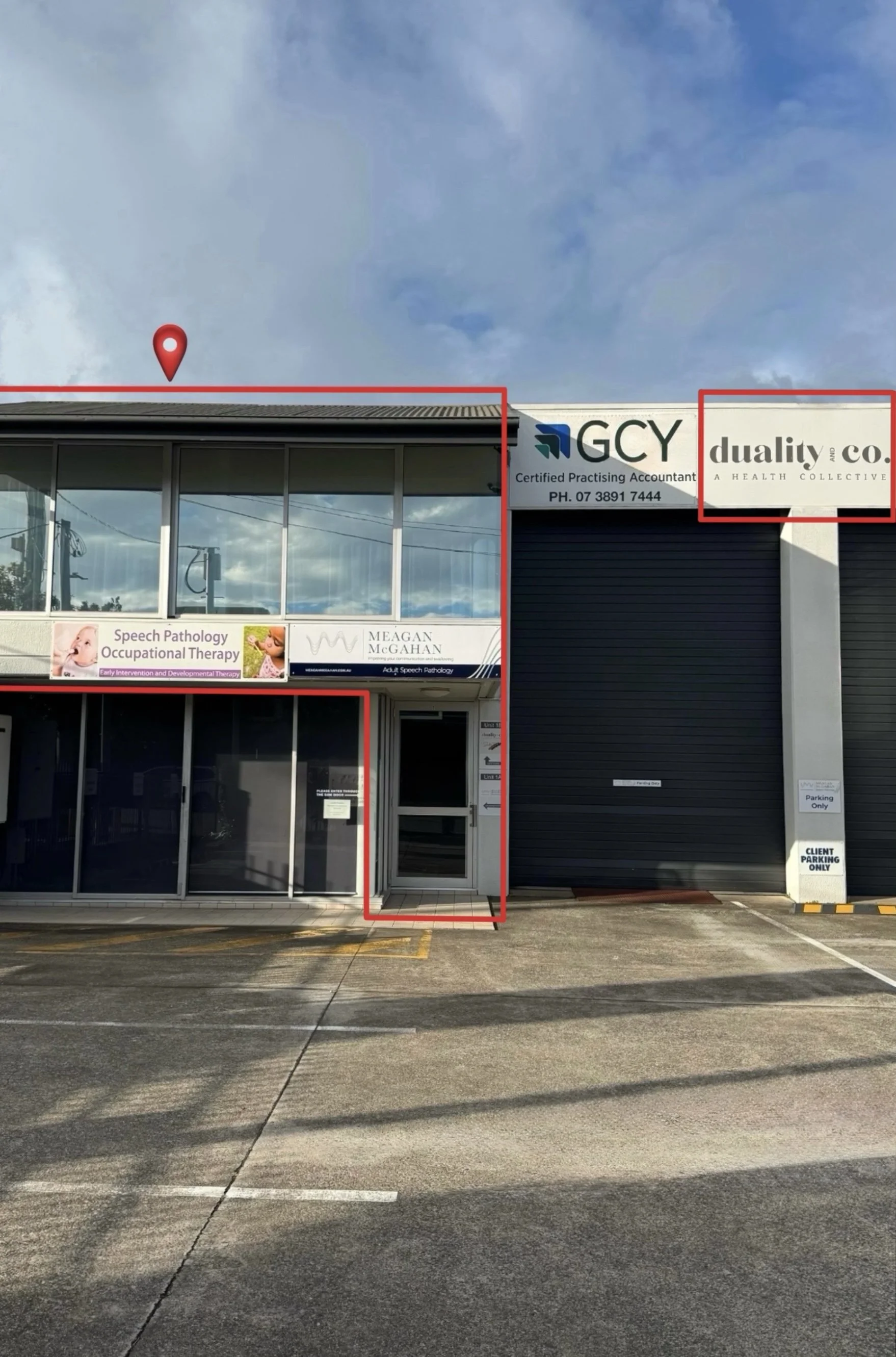 Jen Taylor Psychologist Brisbane EMDR PTSD anxiety Business strip mall storefront with signs for GCY Certified Practising Accountant and Duality and Co. in a parking lot with empty parking spaces and cloudy sky.