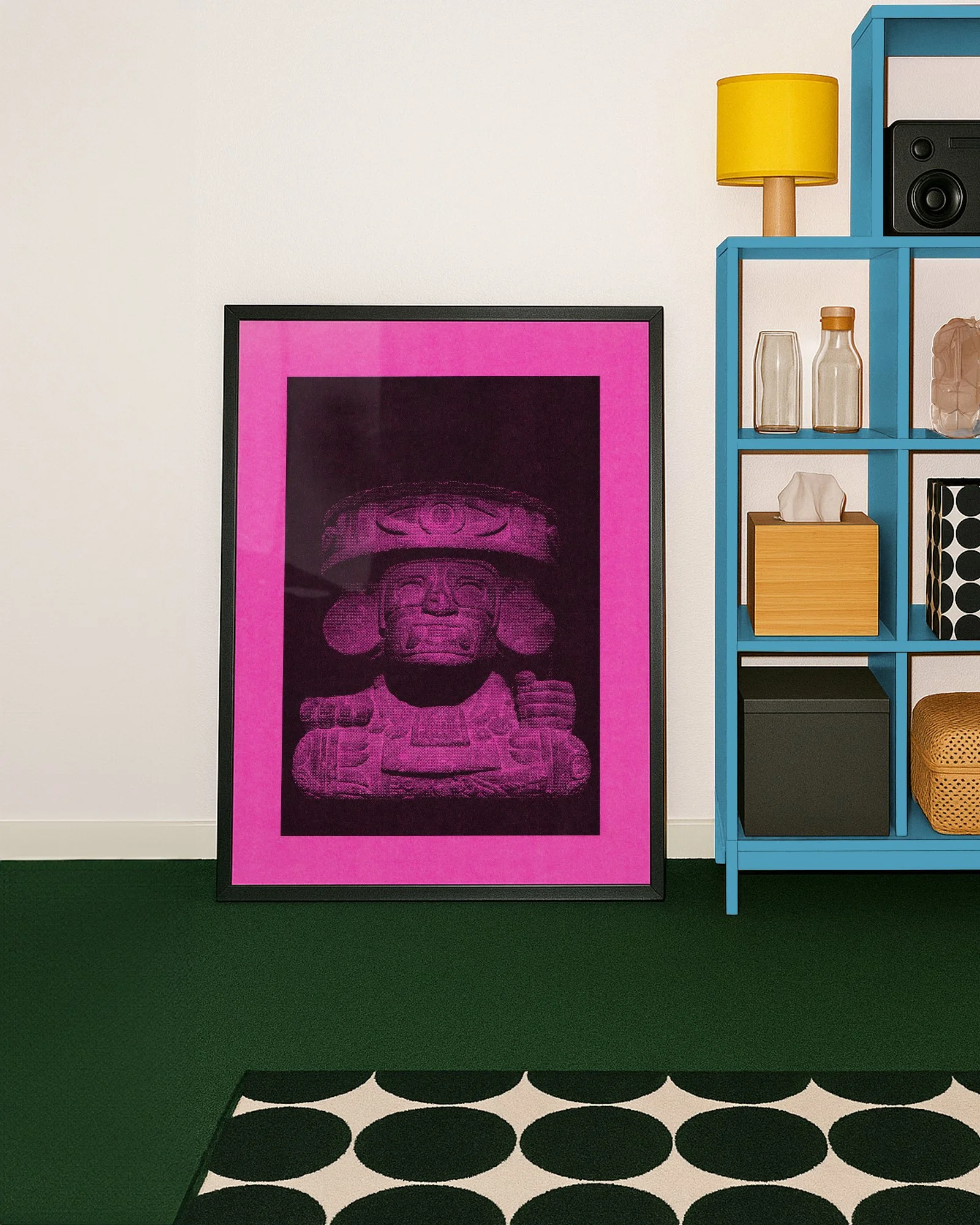 A modern living room interior showcasing a framed pink Dos Olmecas photography poster on the wall next to home decor objects.