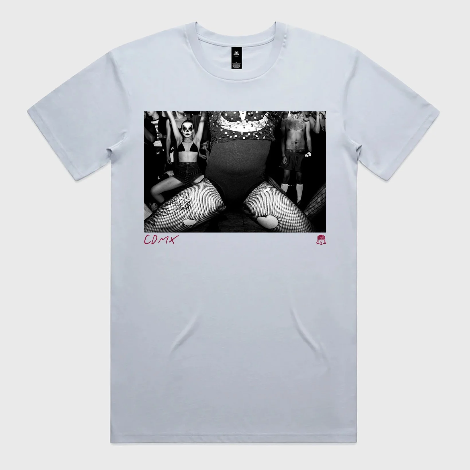 White T-shirt with a black-and-white photo of people at a party, including a woman with face paint and fishnet stockings, and the text 'CDMX' in red.