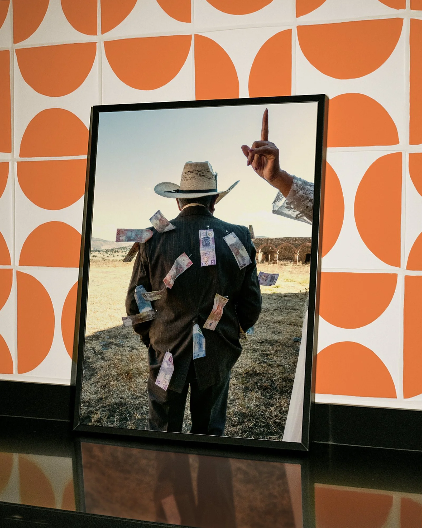 A fine art Mexico photography print featuring a person in a suit and hat with dollar bills attached, set against a Mexican landscape