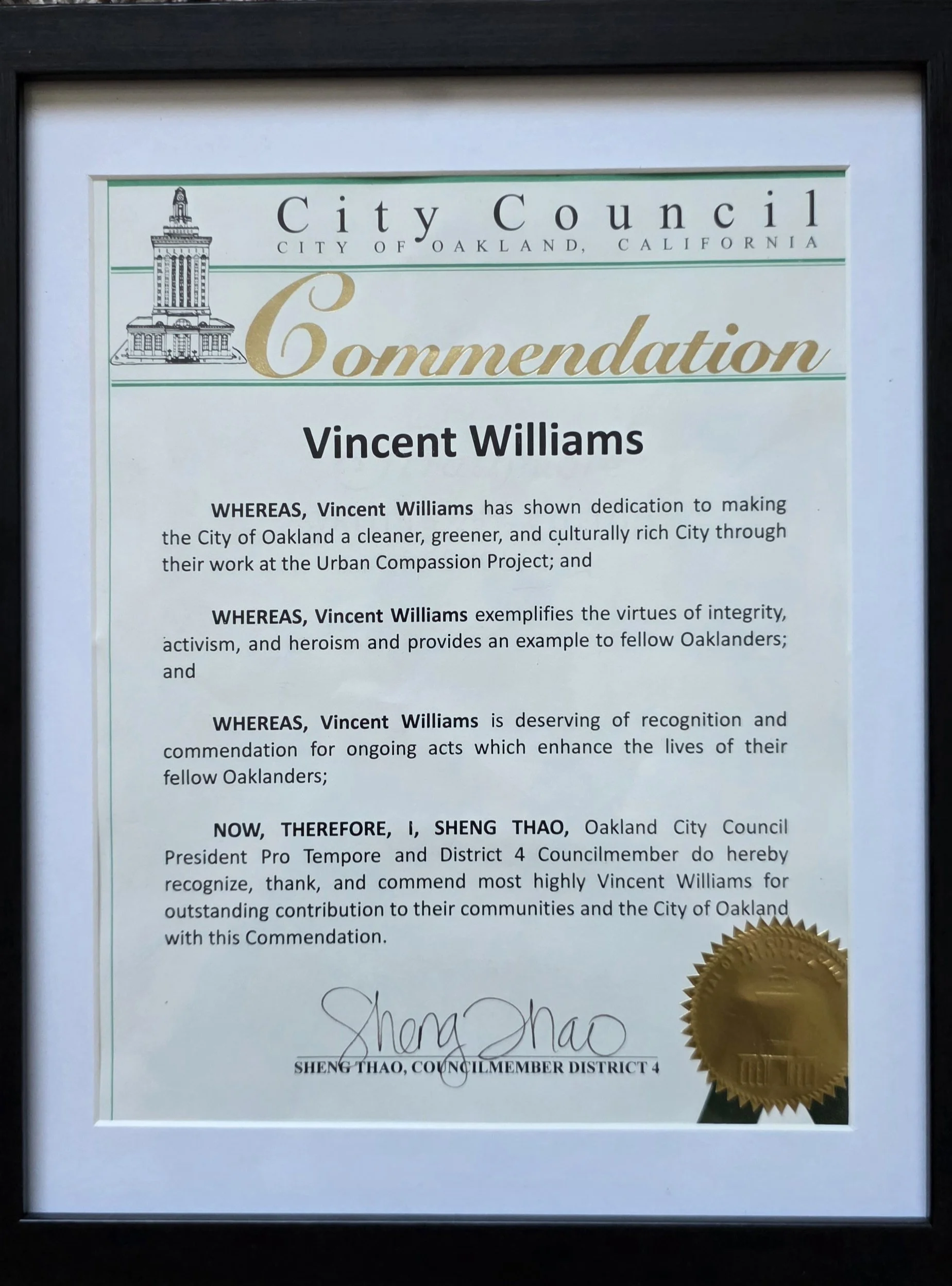 A framed commendation certificate from the City of Oakland, California, recognizing Vincent Williams for his contributions, signed by Sheng Thao, with a gold seal in the lower right corner.
