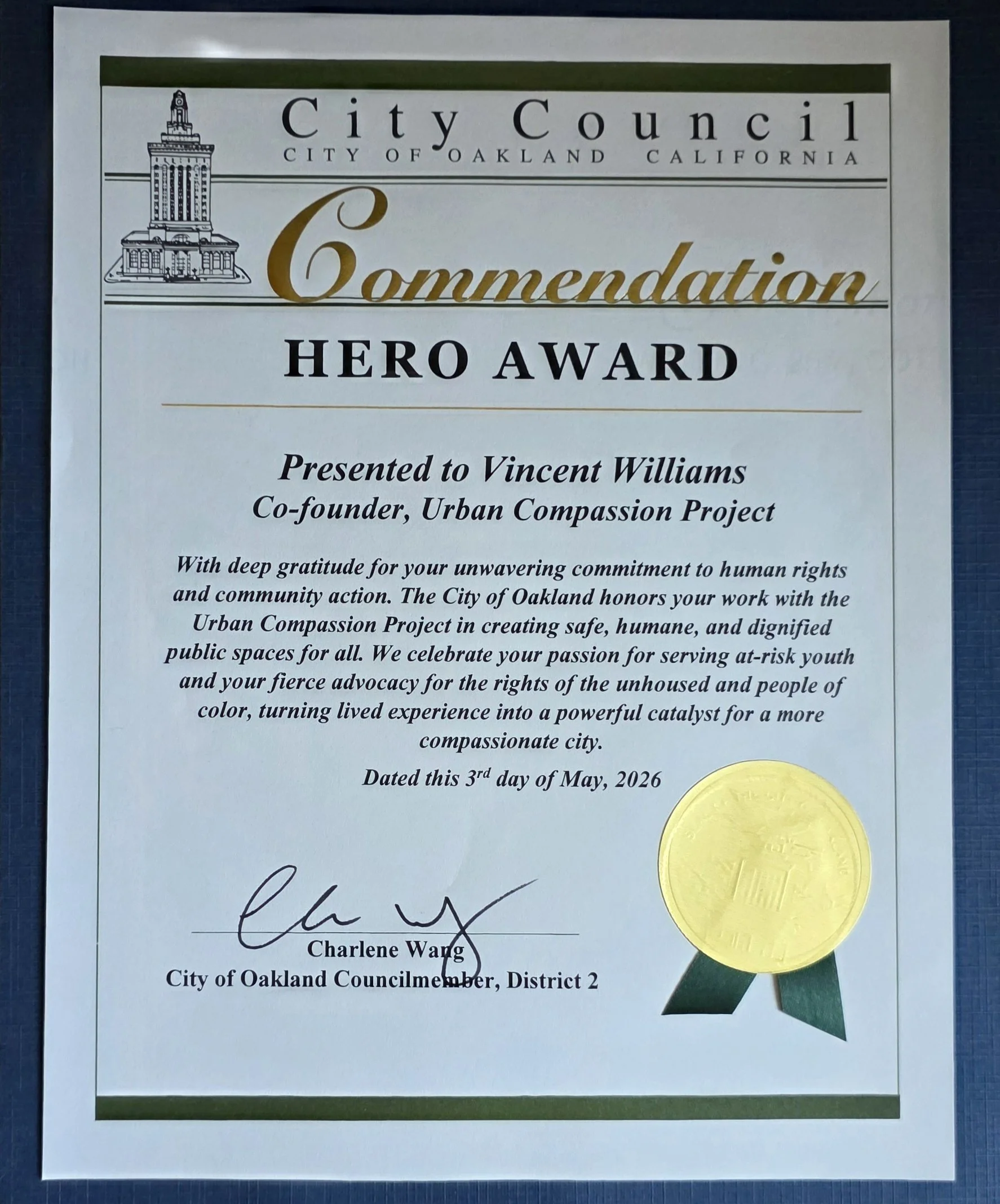 Certificate of appreciation from the City Council of Oakland, California, awarded to Vincent Williams for his work with the Urban Compassion Project, dated May 3rd, 2026, with a gold seal and a green ribbon.