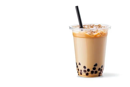 A plastic cup of iced bubble tea with tapioca pearls at the bottom and a black straw.