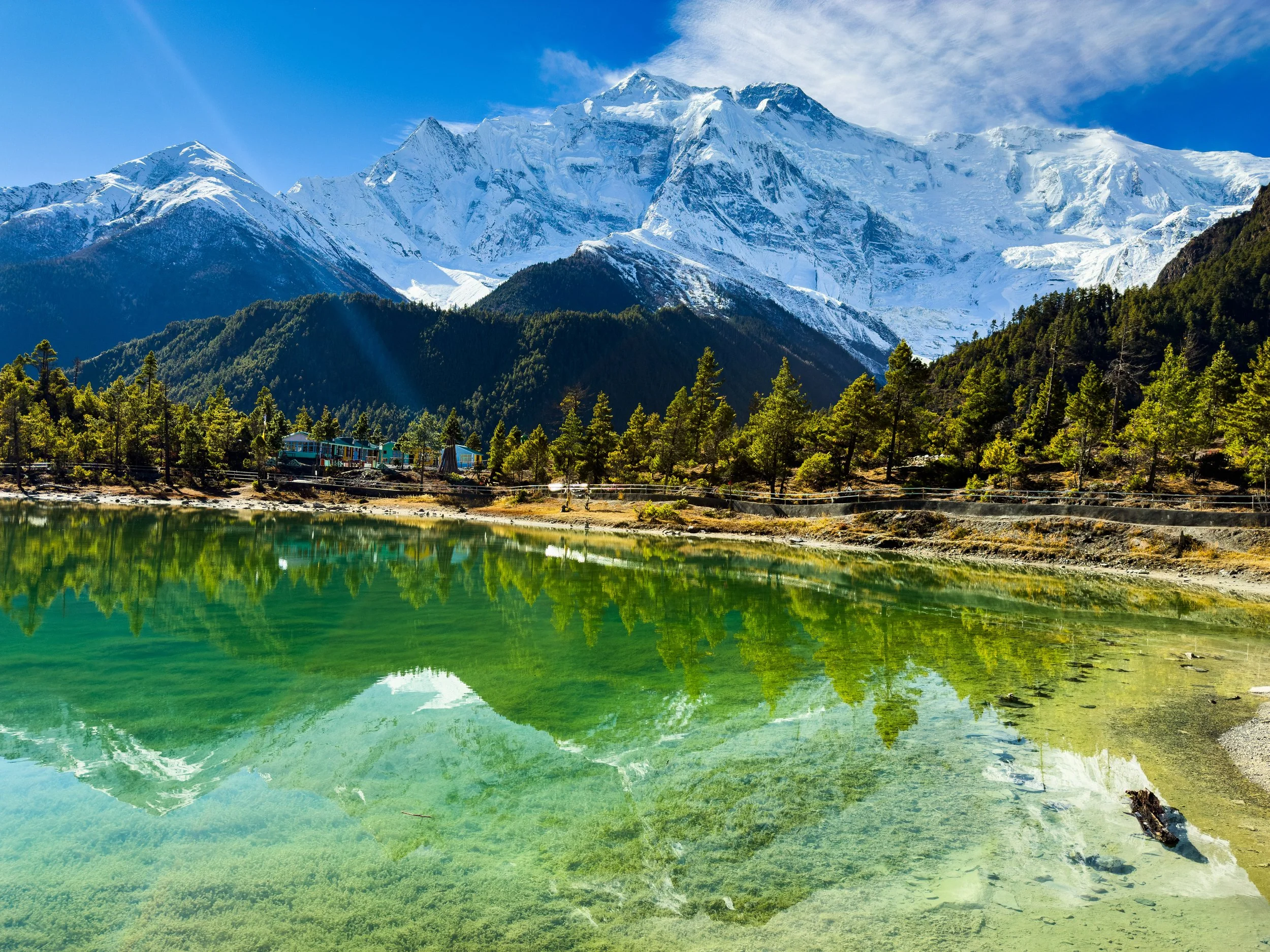 View of Green Lake in Manang with the backdrop of Annapurna II and III. This is enroute Annapurna Circuit Trek few kms ahead of the village of Upper Pisang.