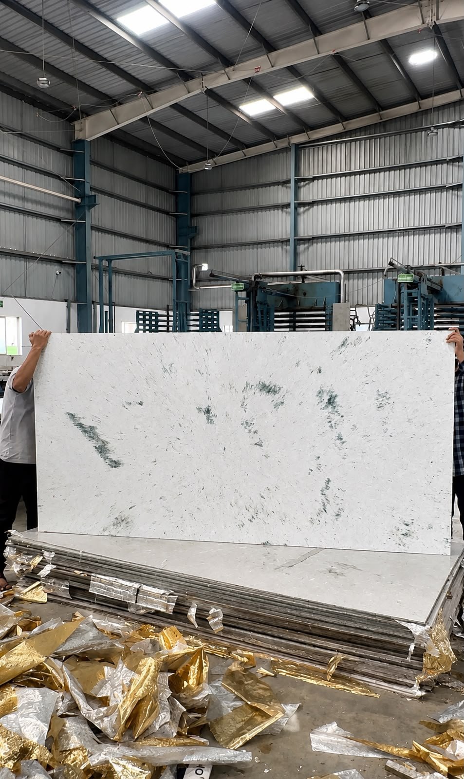 Vetrogreen durable construction sheet made from upcycled multi-layer plastic waste, replacing traditional plywood and cement.