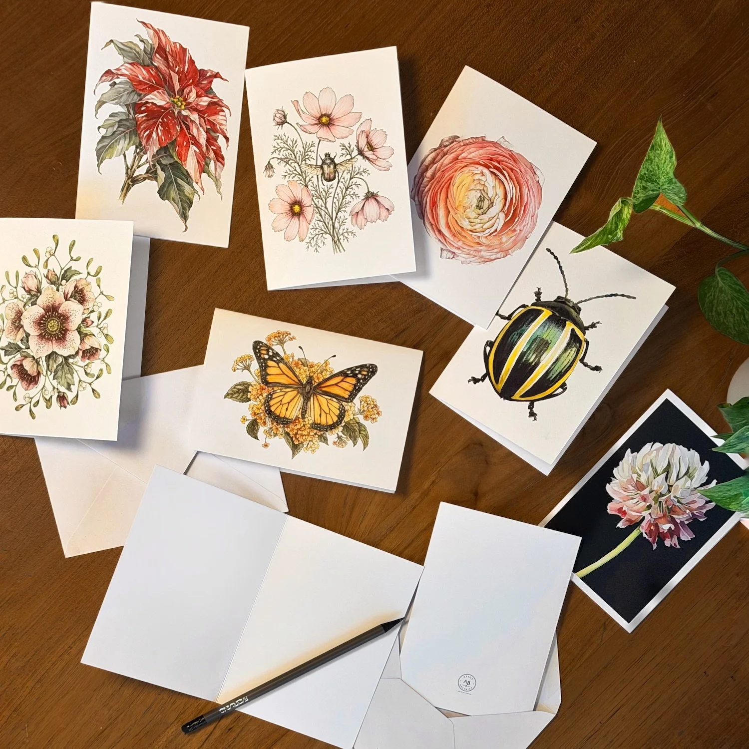 Collection of botanical watercolor greeting cards featuring flowers, insects, butterflies and pomegranates, illustrated by Alice Botanica.