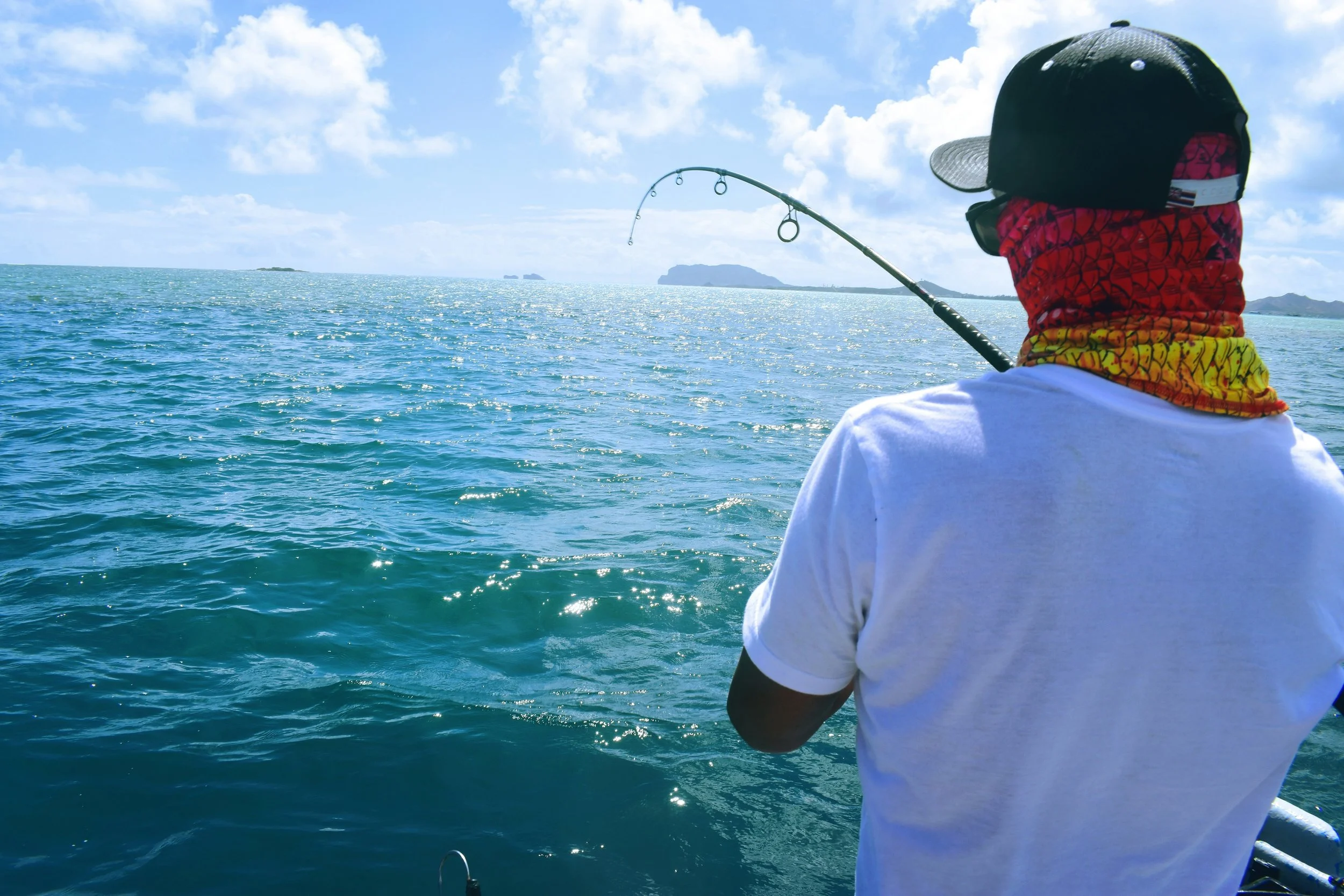 Surfer fishing used to illustrate that current evidence does not mean surfers should stop surfing because of low back pain