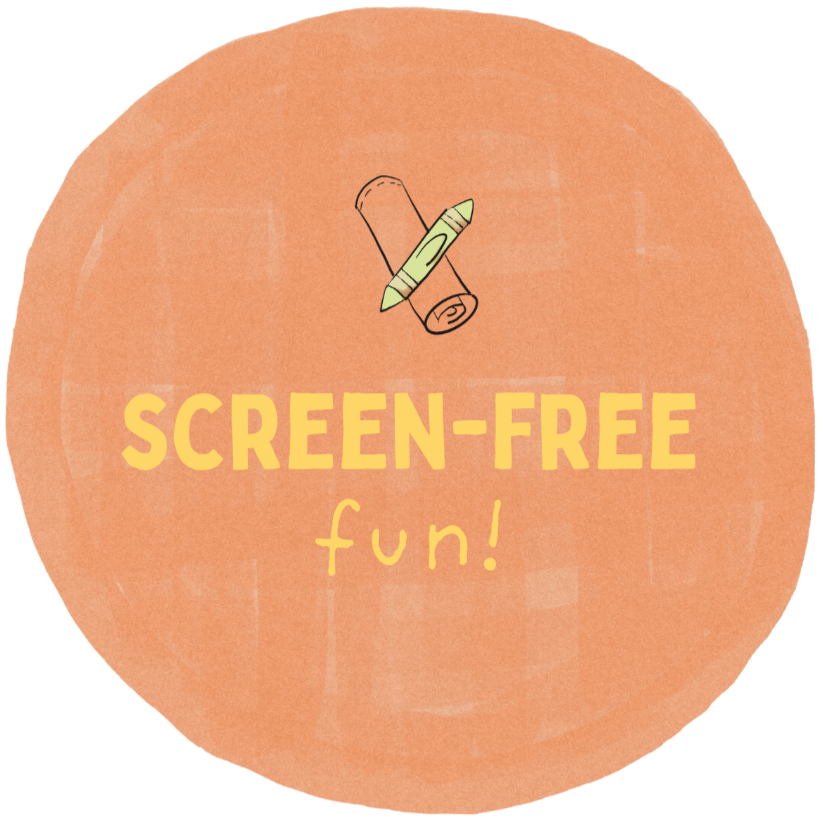 A circular badge with an orange background displaying the text 'SCREEN-FREE fun!' and a small illustration of a rolled-up magazine or paper and a crayon above the text.