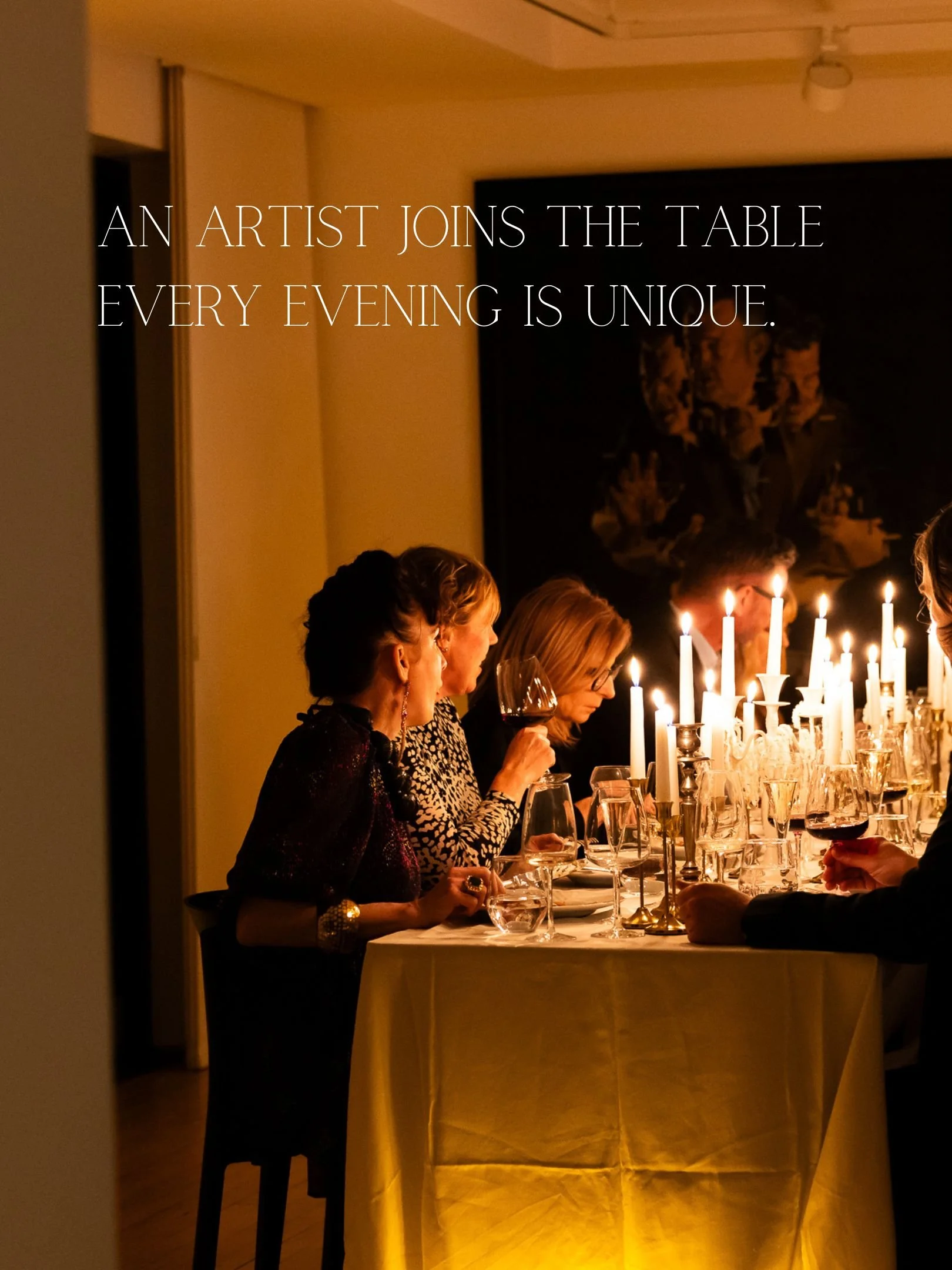 People sitting at a dinner table with candles, evening setting, in a dimly lit room.
