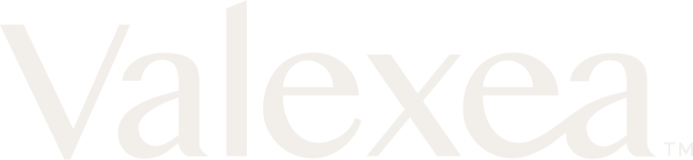 Close-up of the Valexxa logo in gray on a white background.