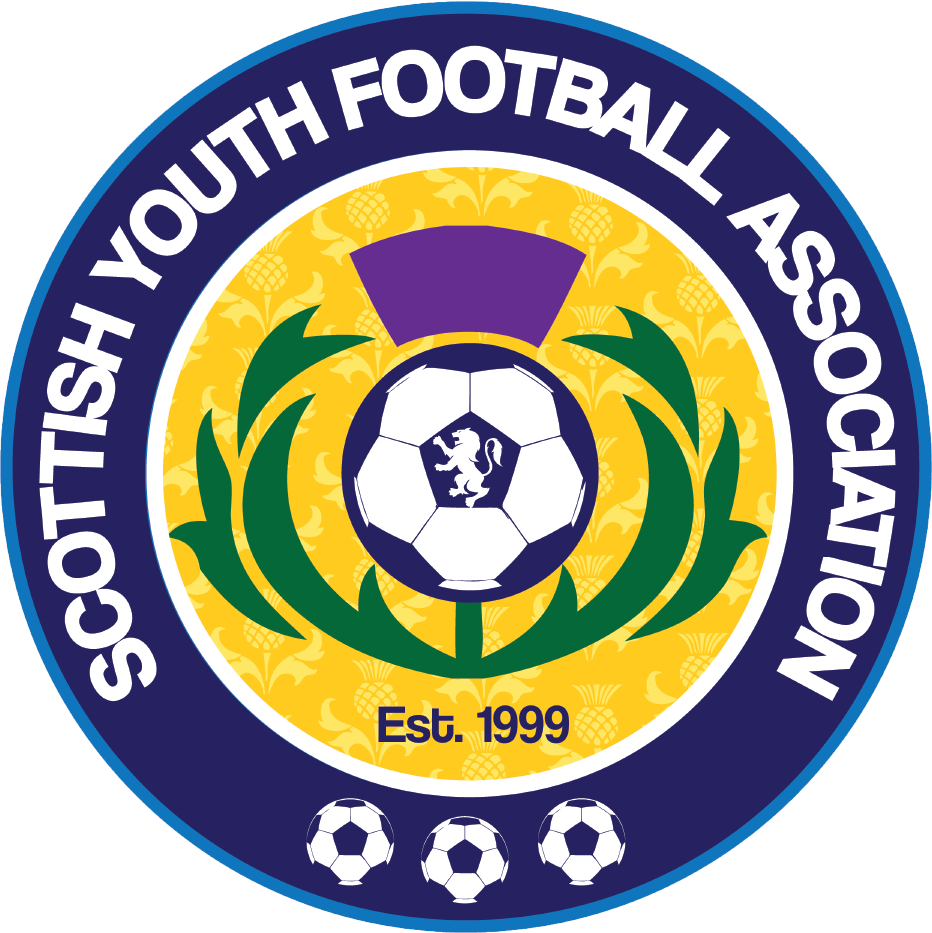 The logo of the Scottish Youth Football Association features a circular design with a yellow background pattern of pineapples. The center displays a black and white soccer ball with a purple crest and a lion emblem. Green laurel branches surround the ball, and there's a purple ribbon at the top. The text states "SCOTTISH YOUTH FOOTBALL ASSOCIATION" around the circle's perimeter, with "Est. 1999" written at the bottom and three smaller soccer balls at the bottom within the circle.